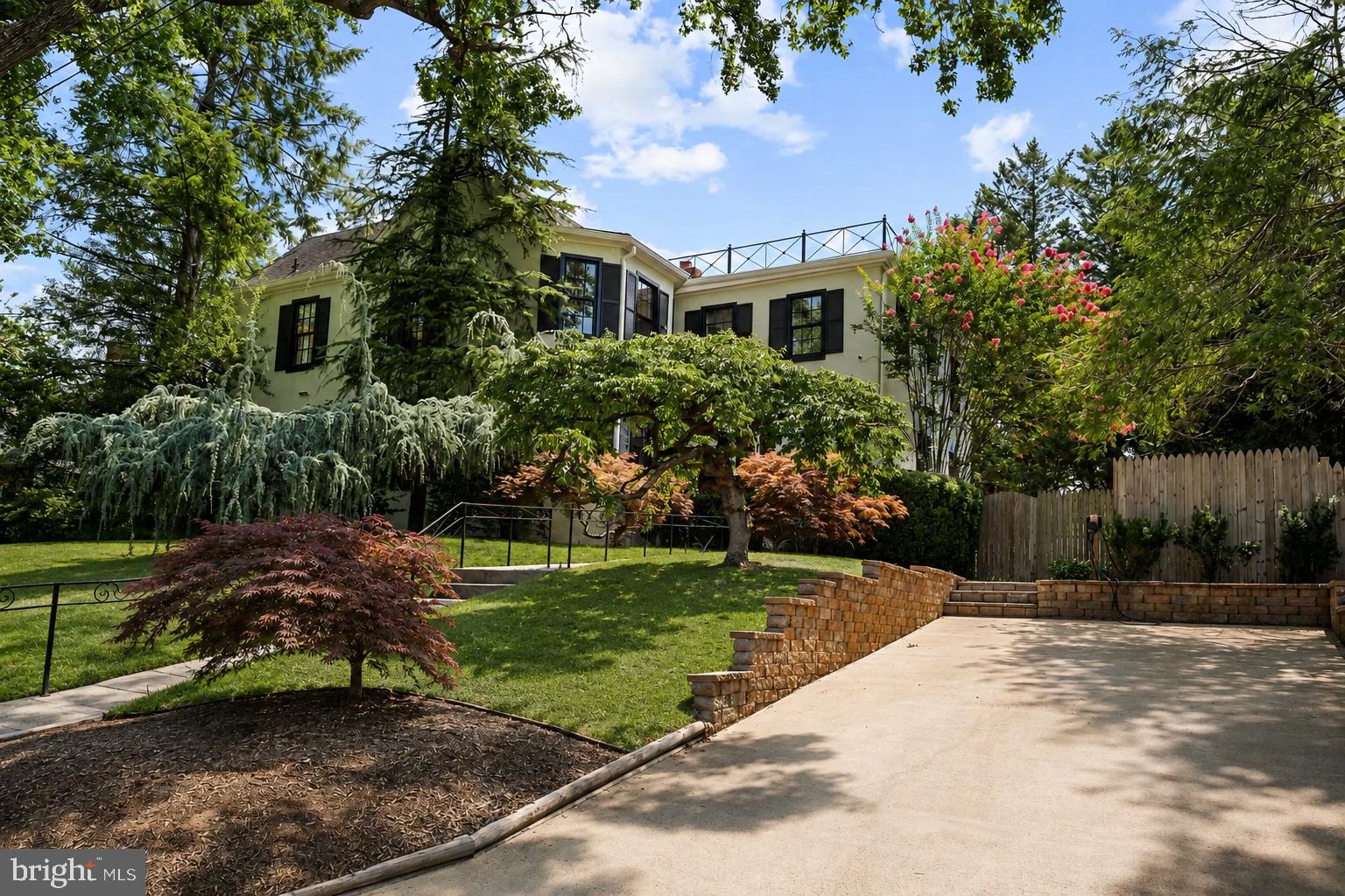 5305 Saratoga Avenue presents a rare opportunity to own an exceptional residence in the heart of Chevy Chase, Maryland. Beautifully reimagined while honoring its architectural heritage, this distinguished 5-bedroom, 3.5-bathroom home offers approximately 3,300 square feet of refined living space on nearly one-quarter of an acre, where timeless elegance and modern comfort exist in perfect harmony.

A gracious foyer introduces interiors filled with natural light, rich hardwood floors, custom millwork, and thoughtfully preserved architectural details. The inviting living room, anchored by a classic fireplace and custom built-ins, offers a warm yet sophisticated setting for intimate gatherings and everyday living.

At the heart of the home, the beautifully appointed gourmet kitchen features premium finishes and opens seamlessly to a sun-filled family room, creating an effortless flow for both entertaining and daily life.

The upper level is highlighted by an elegant primary suite designed as a private sanctuary. A custom walk-in closet and a spa-inspired bath with heated floors, a towel warmer, and designer finishes create a retreat of exceptional comfort. Four additional bedrooms provide exceptional flexibility for family, guests, home offices, or wellness spaces.

Outdoors, the beautifully landscaped grounds offer a true private escape. A spacious deck overlooks the sparkling swimming pool, creating an idyllic backdrop for al fresco dining, summer entertaining, or peaceful afternoons surrounded by mature greenery. An EV charging station further complements the home's thoughtful blend of historic character and contemporary convenience.

Perfectly positioned just moments from Friendship Heights and downtown Bethesda, the residence enjoys effortless access to acclaimed dining, luxury shopping, neighborhood cafés, parks, Metro, and major commuter routes. This coveted location offers the ideal balance of tranquil residential living and vibrant urban convenience.

Elegant, timeless, and exceptionally located, 5305 Saratoga Avenue represents a rare offering in one of Chevy Chase's most desirable neighborhoods. It is a home where historic character has been thoughtfully preserved, modern comforts have been beautifully integrated, and every space has been designed for the way we live today.