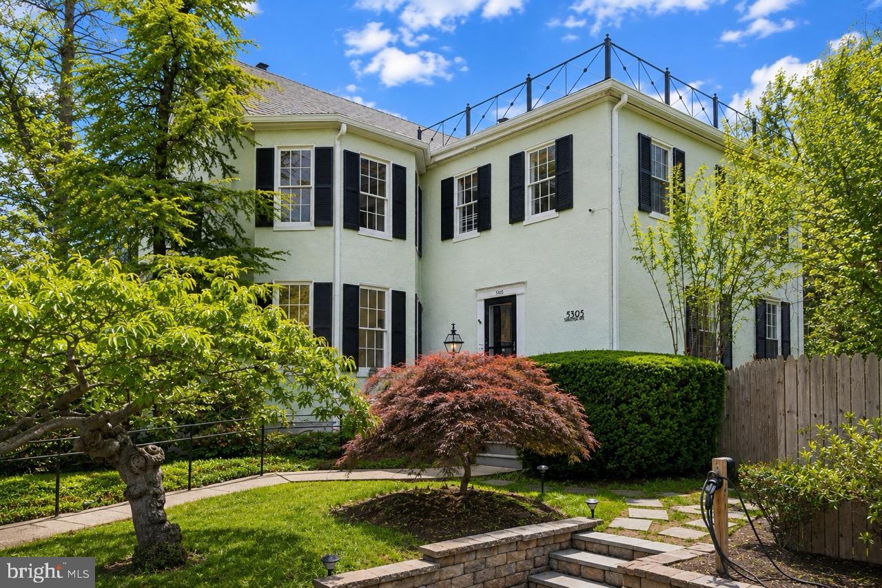 5305 Saratoga Avenue presents a rare opportunity to own an exceptional residence in the heart of Chevy Chase, Maryland. Beautifully reimagined while honoring its architectural heritage, this distinguished 5-bedroom, 3.5-bathroom home offers approximately 3,300 square feet of refined living space on nearly one-quarter of an acre, where timeless elegance and modern comfort exist in perfect harmony.

A gracious foyer introduces interiors filled with natural light, rich hardwood floors, custom millwork, and thoughtfully preserved architectural details. The inviting living room, anchored by a classic fireplace and custom built-ins, offers a warm yet sophisticated setting for intimate gatherings and everyday living.

At the heart of the home, the beautifully appointed gourmet kitchen features premium finishes and opens seamlessly to a sun-filled family room, creating an effortless flow for both entertaining and daily life.

The upper level is highlighted by an elegant primary suite designed as a private sanctuary. A custom walk-in closet and a spa-inspired bath with heated floors, a towel warmer, and designer finishes create a retreat of exceptional comfort. Four additional bedrooms provide exceptional flexibility for family, guests, home offices, or wellness spaces.

Outdoors, the beautifully landscaped grounds offer a true private escape. A spacious deck overlooks the sparkling swimming pool, creating an idyllic backdrop for al fresco dining, summer entertaining, or peaceful afternoons surrounded by mature greenery. An EV charging station further complements the home's thoughtful blend of historic character and contemporary convenience.

Perfectly positioned just moments from Friendship Heights and downtown Bethesda, the residence enjoys effortless access to acclaimed dining, luxury shopping, neighborhood cafés, parks, Metro, and major commuter routes. This coveted location offers the ideal balance of tranquil residential living and vibrant urban convenience.

Elegant, timeless, and exceptionally located, 5305 Saratoga Avenue represents a rare offering in one of Chevy Chase's most desirable neighborhoods. It is a home where historic character has been thoughtfully preserved, modern comforts have been beautifully integrated, and every space has been designed for the way we live today.