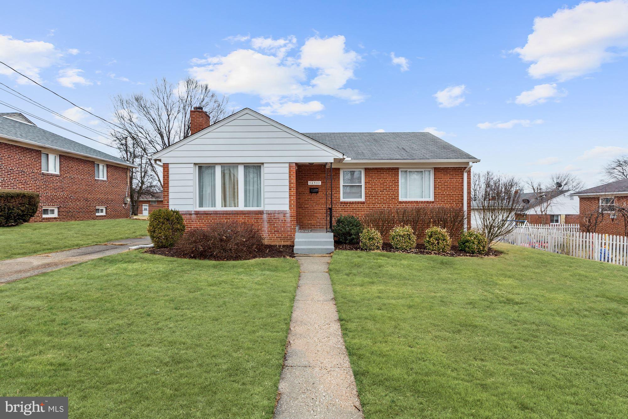 Renovated all brick rambler on fantastic flat lot close to transportation, schools and shopping.  Terrific as an investment property or a home for a lifetime! Renovated Kitchen w/stainless steel appliances, granite counters open to Dining Rm; Big Master Br w/2 add'l BRs up & renov hall bath; great, walk-out lower lvl w/huge rec room, BR & Full Bath. Off street parking!  A MUST see!!