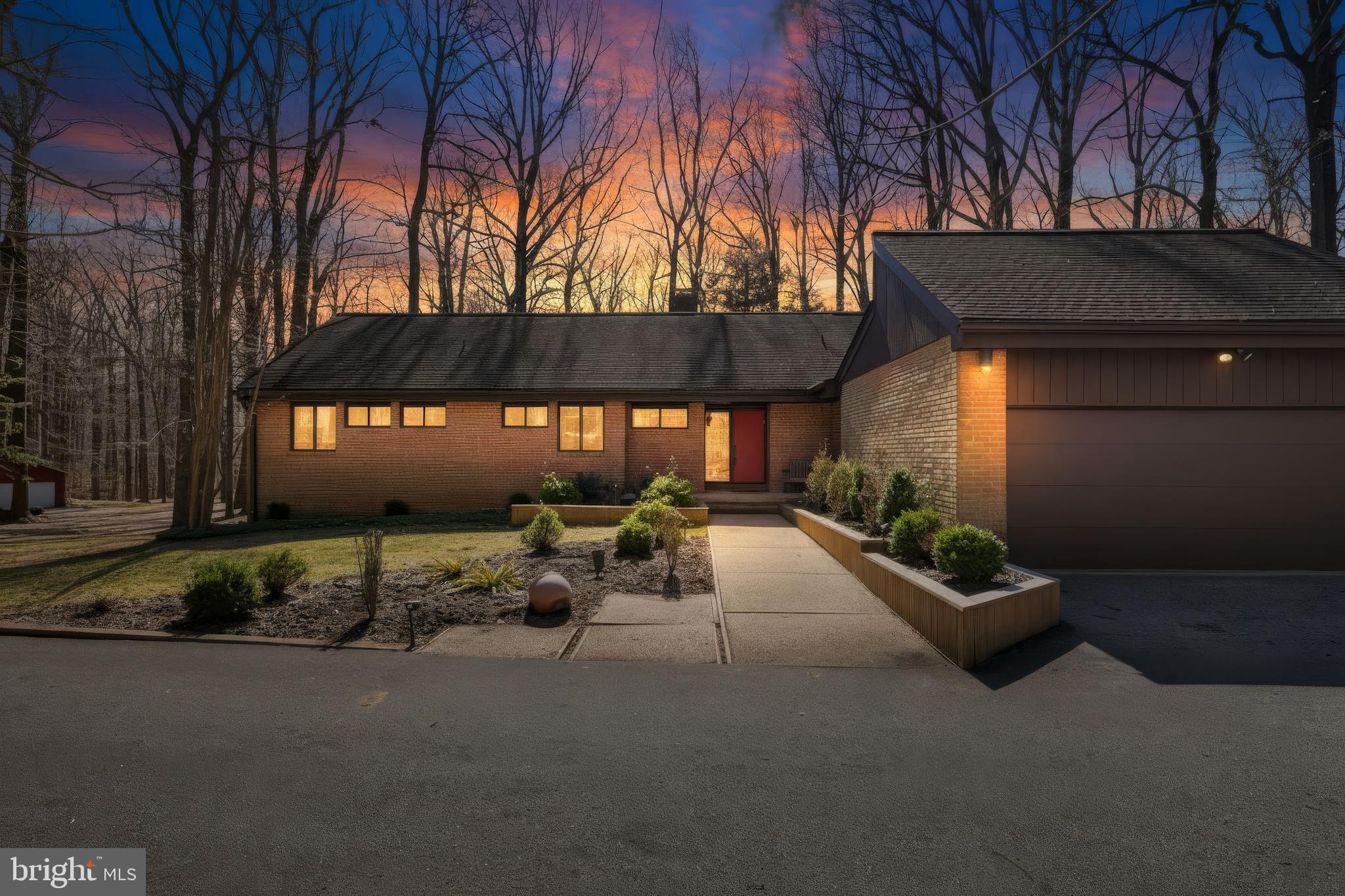 NO HOA-Welcome to 4 Chellis Ct, a beautifully maintained 4-bedroom, 3.5-bath home tucked away on a quiet cul-de-sac in Owings Mills. With two spacious levels, thoughtful updates, and a private wooded backdrop, this home offers both comfort and versatility.

The kitchen blends comfort and convenience, featuring granite countertops, sleek appliances, and double wall ovens, offering both style and functionality for everyday cooking and entertaining. Just off the kitchen is a bright breakfast nook with a sliding glass door leading directly to the outdoor space, creating the perfect spot for morning coffee or casual meals.

From the kitchen, the layout flows naturally into the dining area, filled with natural light, to create an inviting space for gatherings and shared meals. The dining area opens into a vast, bright, and airy living room with vaulted cathedral ceilings, enhancing the open feel of the main living space.

At the center of it all is a striking brick, wood-burning fireplace designed as a walk-around pillar, serving as the architectural centerpiece of the home. The living room wraps around this unique feature and leads into the family room, where a second sliding glass door opens to a large deck overlooking the yard and surrounding trees—perfect for relaxing, entertaining, and enjoying the peaceful outdoor setting.

The three bedrooms are conveniently located on the main level. The primary suite offers a private retreat with a recently updated attached bathroom featuring dual vanities and a walk-in shower. Two additional bedrooms provide comfortable and flexible living space, ideal for guests, family, or a home office. For added convenience, the laundry room is also located on the main floor, making everyday living easier. The level is completed by an additional full bathroom and a half bath, thoughtfully placed to serve both the bedrooms and common living areas.

The lower level adds exceptional flexibility with a bright, spacious recreation room perfect for entertaining, hobbies, or movie nights. A second kitchen/kitchenette with a mini fridge creates the perfect setup for guests or extended living arrangements. This level also includes a fourth bedroom, a bonus room that could serve as an office or additional bedroom, and a full bath with a walk-in shower.

Step outside to enjoy multiple outdoor living spaces, including a large deck that spans the entire length of the home, with multiple access points from the main level. The deck creates a covered patio area below, offering comfortable outdoor spaces ideal for relaxing or entertaining. The spacious backyard backs to mature trees, providing a peaceful setting and added privacy.

An attached two-car garage provides additional storage along with the everyday convenience and security of covered parking.
With its unique architectural fireplace centerpiece, vaulted ceilings, new carpet throughout, and flexible living spaces, 4 Chellis Ct offers the perfect blend of character, comfort, and functionality.