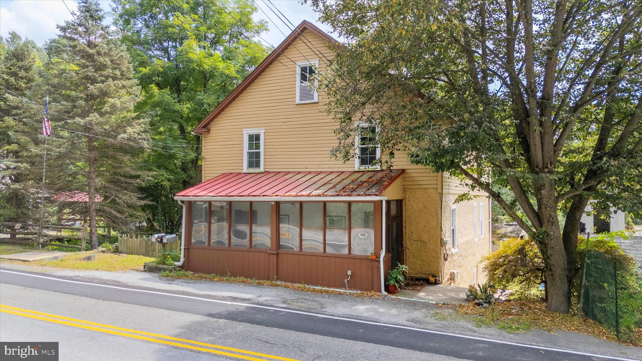Set in the historic and picturesque hamlet of Mortonville in Newlin Township, this unique package of four contiguous properties offers an extraordinary opportunity for visionary residential, mixed use or commercial redevelopment. Listed at a combined $675,000, the offering includes both land and structures across a total of approximately 2.05 acres with varied zoning and flexible potential.  Included is a twin residential dwelling at 2090 & 2092 Strasburg Rd (Tax ID: 49-01-0009.0100), offering 0.1976 acres of R10-zoned property. This twin house could serve as rental income, live/work accommodations, or even short-term lodging—adding critical value to your investment. Anchoring the portfolio is 2094 Strasburg Road (Tax ID: 49-01-0010), the storied site of the former Dugals Inn. Zoned FRD – Flexible Rural Development, with an added Village Overlay District, this parcel spans 0.1899 acres and holds deep potential for revitalization into a community favorite—think a destination restaurant, craft brewery, or country-style retail space. Adjacent is a spacious, paved parking lot (Tax ID: 49-01-012), comprising 1.5545 acres of level ground. Zoned V10 this lot allows for ample customer parking, outdoor seating or event staging space, and future auxiliary development. Rounding out the package is a second paved lot across the street at 2089 Strasburg Rd (Tax ID: 49-01-0001.0100), adding another 0.1112 acres of usable land, also zoned V10. Key infrastructure updates include an approved septic permit for the twin home parcel, with pump-and-haul capability planned for redevelopment on the former Dugals Inn site. Two well-positioned parking lots—one in the rear and one across the road—make it feasible to accommodate both guests and staff. With steady traffic along Strasburg Road and flexible zoning, this offering is a blank canvas for a thoughtful developer, business owner, or investor to craft a vibrant new destination in scenic Chester County.