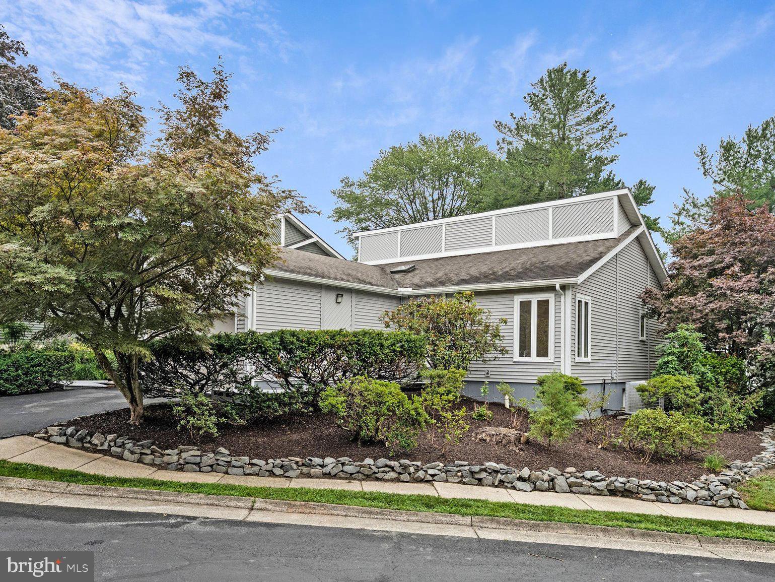 This stunning contemporary 2,672 SF home offers a coveted MAIN FLOOR primary BEDROOM suite,  GARAGE and $100k in updates. Eat-in kitchen features granite countertops, abundant cabinetry, and new stainless appliances (refrigerator and stove). The light-filled living/dining room features vaulted ceilings, skylights, a wood-burning fireplace, refinished hardwood floors and double French doors.
The primary suite is a private oasis featuring two generous WALK-IN closets and a NEW renovated luxury bath (2026) with a lavish walk-in shower, a freestanding soaking tub, and dual vanity—a spa-like retreat at home. A second bedroom and an updated hall bath complete the elegant main level. 
The inviting lower level doubles your entertaining options with a spacious den—perfect for movie night, games, or a pool table—plus two well-sized bedrooms, an updated bath, new flooring, a dedicated laundry/work room and separate storage room. Electric HVAC and hot water heater (2017).
Oversized garage.
Prime Vienna location: Close to top-rated schools, the vibrant downtown Vienna dining and shopping scene, and the scenic W&OD Trail. 5 minutes to Tysons, 2.5 miles to the Mosaic District, 2.3 miles to the Metro, with effortless access to 495 and 66. Proximity to Tysons, McLean, Reston, Falls Church, and DC makes this a well-connected haven.