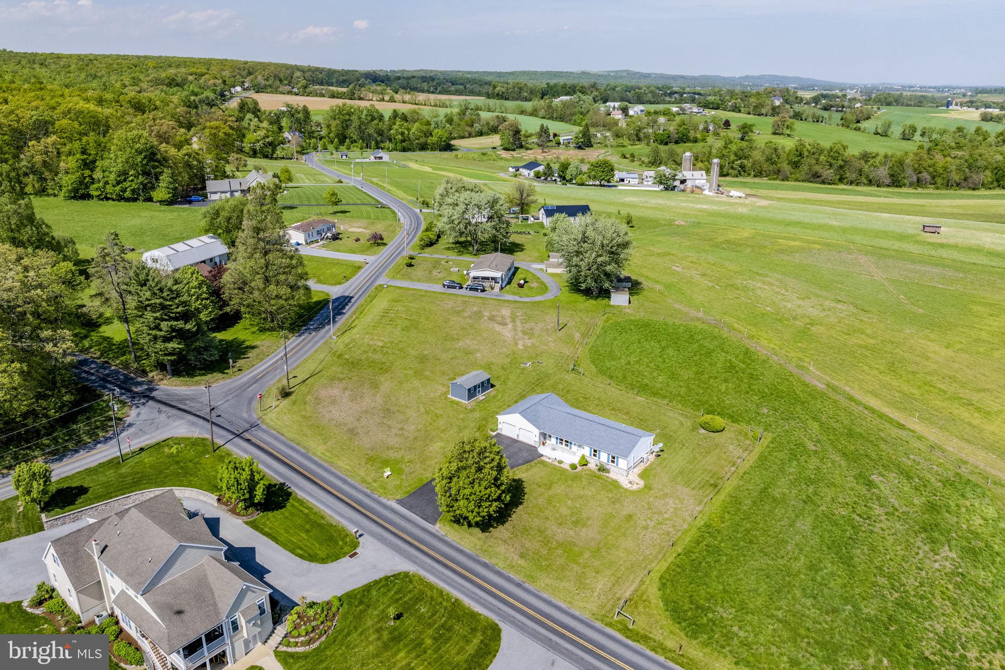 AUCTION PROPERTY.  AUCTION DATE - SATURDAY, AUGUST 15th @ 10AM.   List price is opening bid only and is not indicative of the final sale price. Property must go to auction. TERMS:  10% down day of auction, balance 60 days or before.  Buyer pays both transfer taxes (2% of sale price).  REAL ESTATE: 
Rural stone/vinyl Rancher w/1932 SF finished area, eat-in kitchen w/oak cabinets & appliances, living room, large family room, 3 bedrooms w/bonus 4th bedroom, full bath, full basement, mini split heat w/central AC & electric heat, 2 car attached garage 24x30, low maintenance exterior, insulated & some tilt windows all on 1.3 ACRE m/l country lot w/on-site well & septic.  Frontage on Meetinghouse & Meadville Roads. Ideal country view bordered by farmland. ZONED AG. NOTE:  After 9 years owner relocating to Lycoming County & serious to sell.  Economical & low maintenance Rancher w/plenty of area to expand. Convenient location.  Minutes to East Earl, Narvon, White Horse, New Holland.  Pequea Valley schools. OPEN HOUSE DATES: Saturday, July 25, August 1 & 8 from 1 to 4PM.