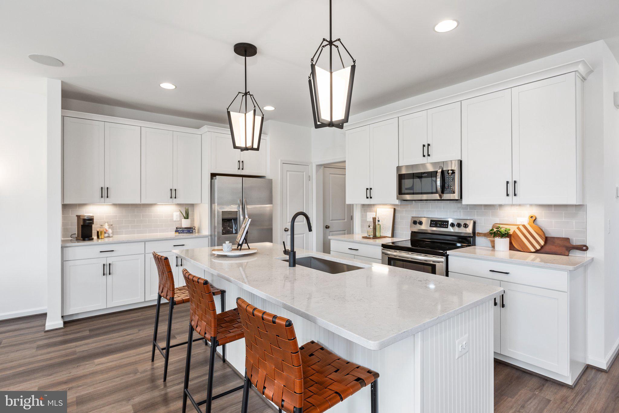 Award-winning layout, white kitchen, open concept, March/April Delivery. 

The Ramsay is a spacious attached duet home that lives like a single-family detached with over 2,025 square feet on the upper two levels. The main level features a desirable open layout with great room, dining area, and gorgeous kitchen with a large island and pantry.  Upstairs is highlighted by a peaceful rear owner's suite with two large walk-in closets and deluxe bath with dual vanities, spacious shower, and enclosed water closet. A large laundry room, two additional bedrooms, and a hall bath complete this living level. You'll find even more living space on the lower level!
 
This duet home features  the Enhanced Timeless Design Collection with Special Design Enhancements, including Kitchen Enhancement #1, Luxury Bath Upgrade with dual showerheads; and Tray Ceiling in the Owner's Suite:

Flooring
Mohawk LVP Flooring in Westward 2.0 Juneau- Main Level Common Areas
Reactive Carpet in Cross County - All Bedrooms, Rec Room, Upper Hall & All Stairs

Kitchen
Aristokraft Purestyle Brellin Kitchen Cabinets in White
Helix Silestone Quartz Countertops
Gray Glossy 3"X6" Subway Tile Backsplash
Gourmet Stainless Steel Appliance Pkg

Owner's Bath
Cabo Ocean 12"X24" Ceramic Tile
Luna Pearl Countertop
Aristokraft Purestyle Brellin Bathroom Cabinet in White

Secondary Baths
Cabo 13"x13" Ceramic Tile in Shore
White Cultured Marble Bathroom Countertop
Aristokraft Sinclair Cabinets in Sarsaparilla 

Included Rec Room

Outdoor 
Landing & Stairs 
Partially Fenced Backyard