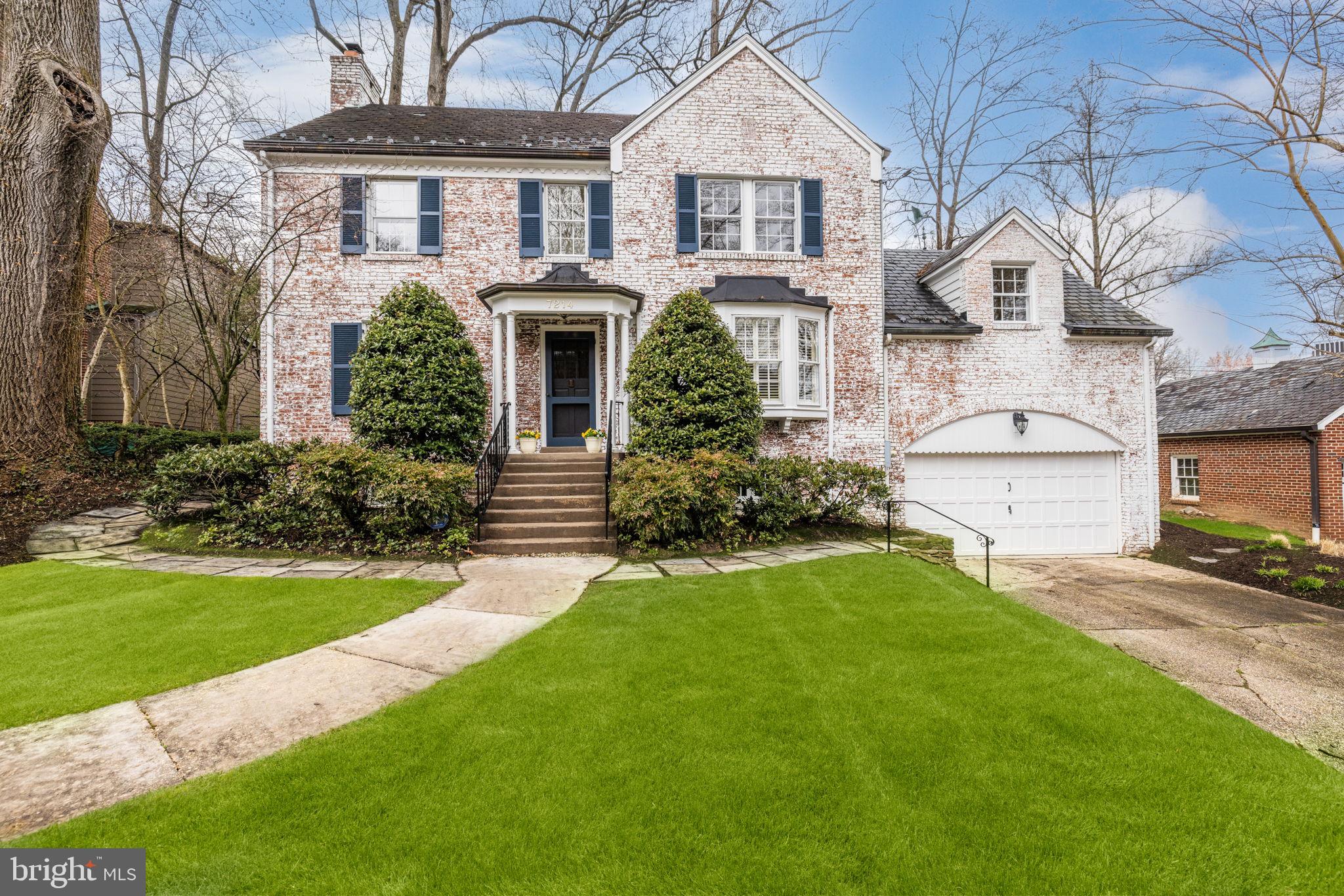 Welcome Home!  Brick colonial features charming rooms on the main level including a den with a window seat, office, half bath, living room with fireplace, foyer, dining room, and galley kitchen.  Freshly painted,  plenty of built-in cabinets and shelving, and new carpeting on the Lower Level.  The Upper Level features three bedrooms and two full baths (one room has an attached "bonus" room).  The top floor is finished and carpeted.  The Lower Level includes a recreation room with fireplace,  guest room, full bath, and laundry/utility room with walkout access and access to an attached two-car garage.  Lovely landscaping and patio with access from the kitchen and office.
