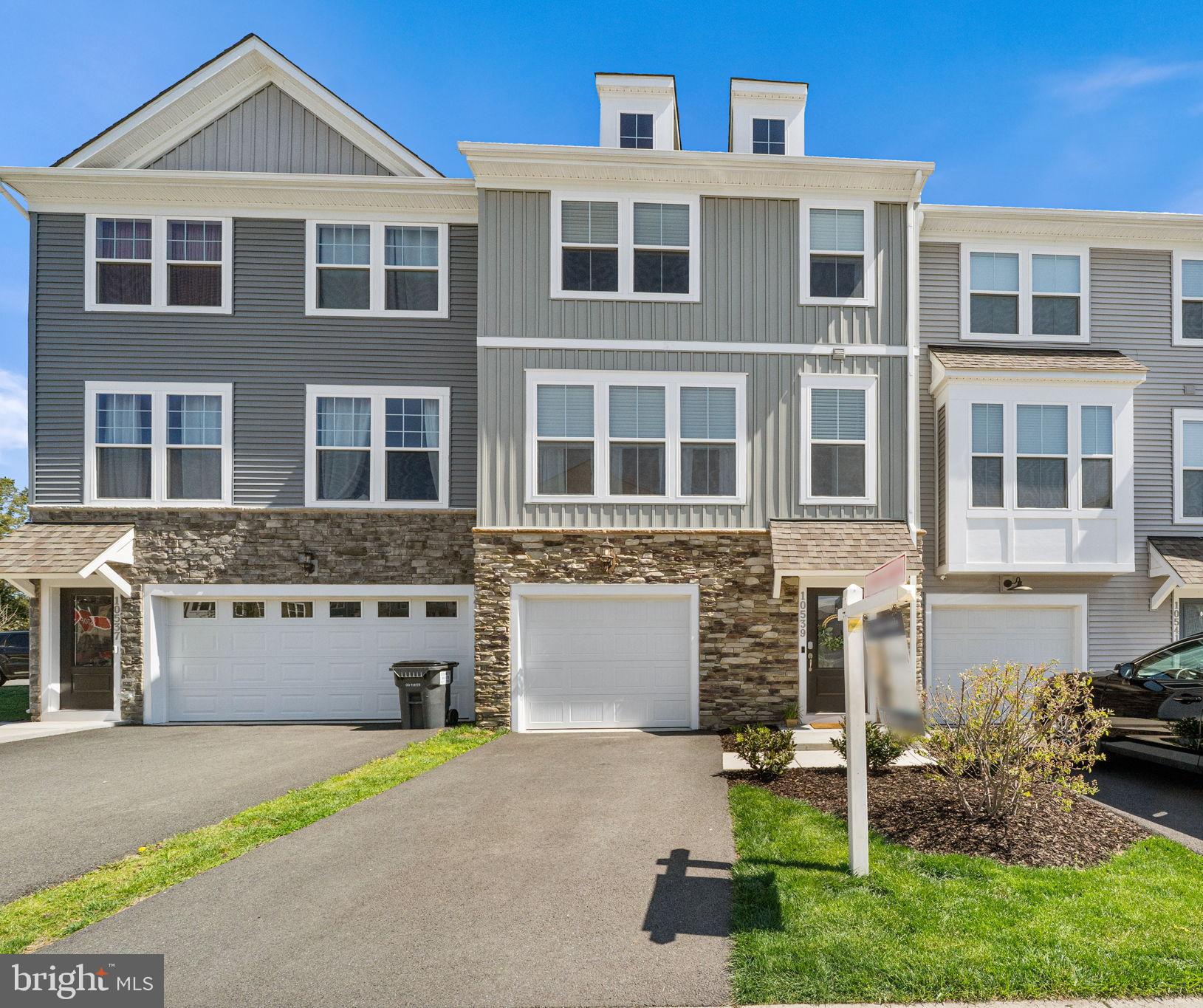 Welcome Home to this beautifully designed 3 bedroom/2 full bath/2 half bath, nearly new townhome offering the perfect blend of modern style, comfort, and convenience.

Built in 2023, this thoughtfully crafted and meticulously maintained townhome features over 2,000 square feet of light-filled living space.  From the moment you enter, you’ll appreciate the contemporary finishes, clean lines, and seamless flow ideal for both everyday living and entertaining.

Step inside an inviting and sizable foyer that leads you to a large flex room with its own half bath, perfect for guests, family room or bonus play space. Sliding doors provide access to a private fenced backyard, which is large enough for your own play equipment. The 1-car garage houses custom storage shelving and is ideal for woodworking, gardening, your classic car, or any other hobby requiring extra space.

The heart of the home is the open main level, where a stylish kitchen opens effortlessly to the dining and living areas that is perfect for hosting gatherings or enjoying quiet evenings at home. Enjoy an expansive island for breakfast or casual conversations or sit together at your table, there is room for both! With its stainless steel appliances, tall dark wood cabinetry, and beautiful quartz counters, this kitchen is the peak of elegance and functionality. Huge sliding glass doors open onto a spacious private deck, perfect for al fresco dinners or enjoying a cup of coffee in the morning.  

Upstairs, you’ll find a luxurious primary ensuite retreat featuring a spacious bathroom with a double-sink vanity and a large walk-in closet. Two additional well-appointed bedrooms and a full hall bathroom provide ample space for family or guests. For added convenience, a high-efficiency washer and dryer are also located on this level.

Nestled in the desirable Bradley Square community, this home offers scenic surroundings—including nearby green space, a community lake and playground —along with easy access to major commuter routes, shopping, dining, and top-rated schools. Walk from your front door to the drop-off location in minutes!