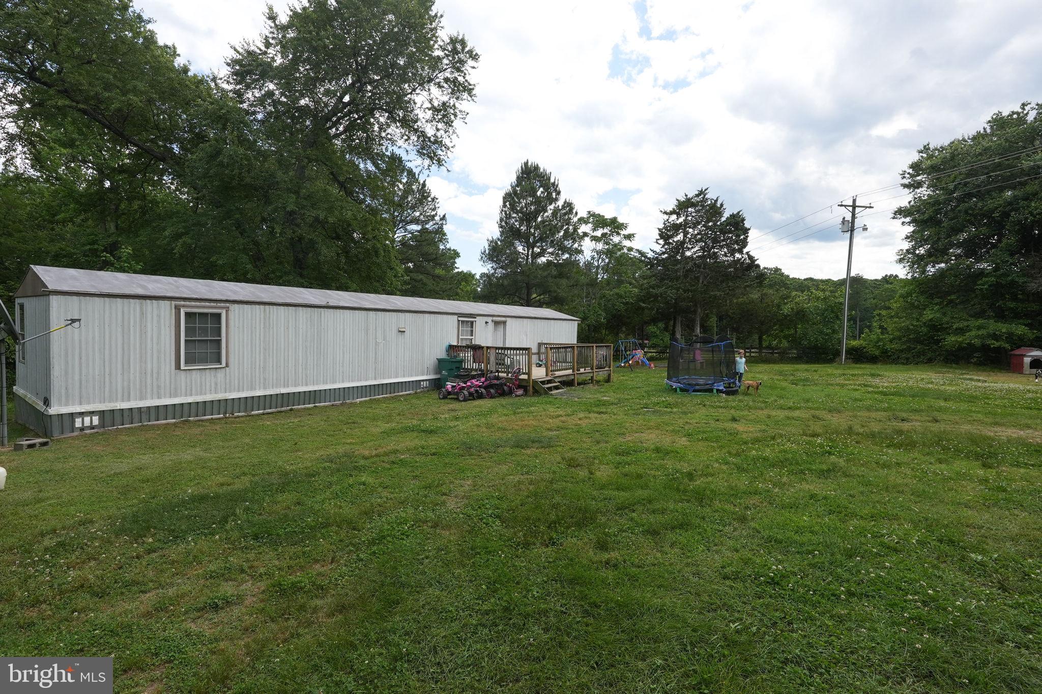 We’re pleased to announce this property as an unbeatable opportunity for buyers looking to invest near Lake Anna! 🌊 Don’t let this opportunity slip away! Now is the perfect time to explore all that this incredible property has to offer with unlimited possibilities! ✨ 

**Key Features of the Property:** 
- **Mobile Home**: This cozy mobile home includes 2 bedrooms 🛏️ and 2 bathrooms 🛁, providing a comfortable retreat in a serene setting. 
- **Utilities**: Equipped with a well and septic system, this property offers convenience and ease. 💧 
- **Spacious Acreage**: With nearly 6 acres at your disposal, the possibilities for creating your oasis are endless. 🌳 

**Expand Your Horizons**: Interested in more space? The adjacent properties (4901, and 4911, Lewiston Rd.) are also available, offering the chance to acquire approximately 32.87 acres in total! 🌟 **Same Seller**! 🏡