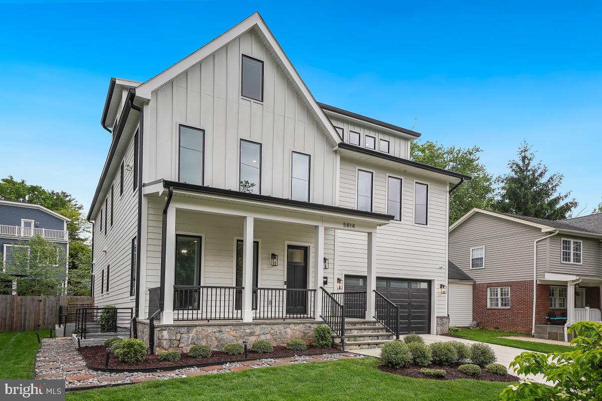 Built in 2021, this better-than-new, barely-lived in home features 6 bedrooms, 5.5 bathrooms, a third level au pair/guest suite and bonus room, two laundry rooms, and a lower level apartment in a four-story, modern farmhouse design. Impressive curb appeal and a welcoming front porch introduce this outstanding property. Greeted by the main-level library/office with French doors, the foyer opens to the dramatic open-concept living area. The kitchen—which showcases a large, centered waterfall island with a breakfast bar, Fulgor Milano appliances including double wall ovens, ample counter space and cabinetry—adjoins the dining area, which is outlined by nearly floor-to-ceiling windows and French door access to the rear porch and backyard. The dining area flows seamlessly into the light-filled living room with its modern, stone-encased fireplace. Upstairs, the second floor finds 4 bedrooms with walk-in closets and three bathrooms, highlighted by the owner’s suite with its dual walk-in closets and en-suite bath with a double vanity, glass shower, stand-alone tub, and private commode area. This level also includes a convenient laundry room. The fifth bedroom with a bathroom and an open bonus room is found on the next upper level. Access to the lower level is off the foyer or via a private, exterior side entrance. The in-law/guest suite is comprised of a bedroom, bathroom with dressing area, walk-in closet, separate laundry, living room, kitchen recreation room and entertainment area. A separate recreation room is also found here. A 2-car garage with a pebble tech floor and an electric car charger, custom window treatments—most with smart Lutron switches—10-foot ceilings, hardwood floors, energy-saving LED lighting throughout and a fenced rear yard complete this outstanding home. Perfectly located, NIH, Walter Reed, downtown Bethesda and Ayrlawn Park are just steps away. With easy access to major transportation routes, commuting to downtown Washington, DC, northern Virginia and area airports is a breeze.
