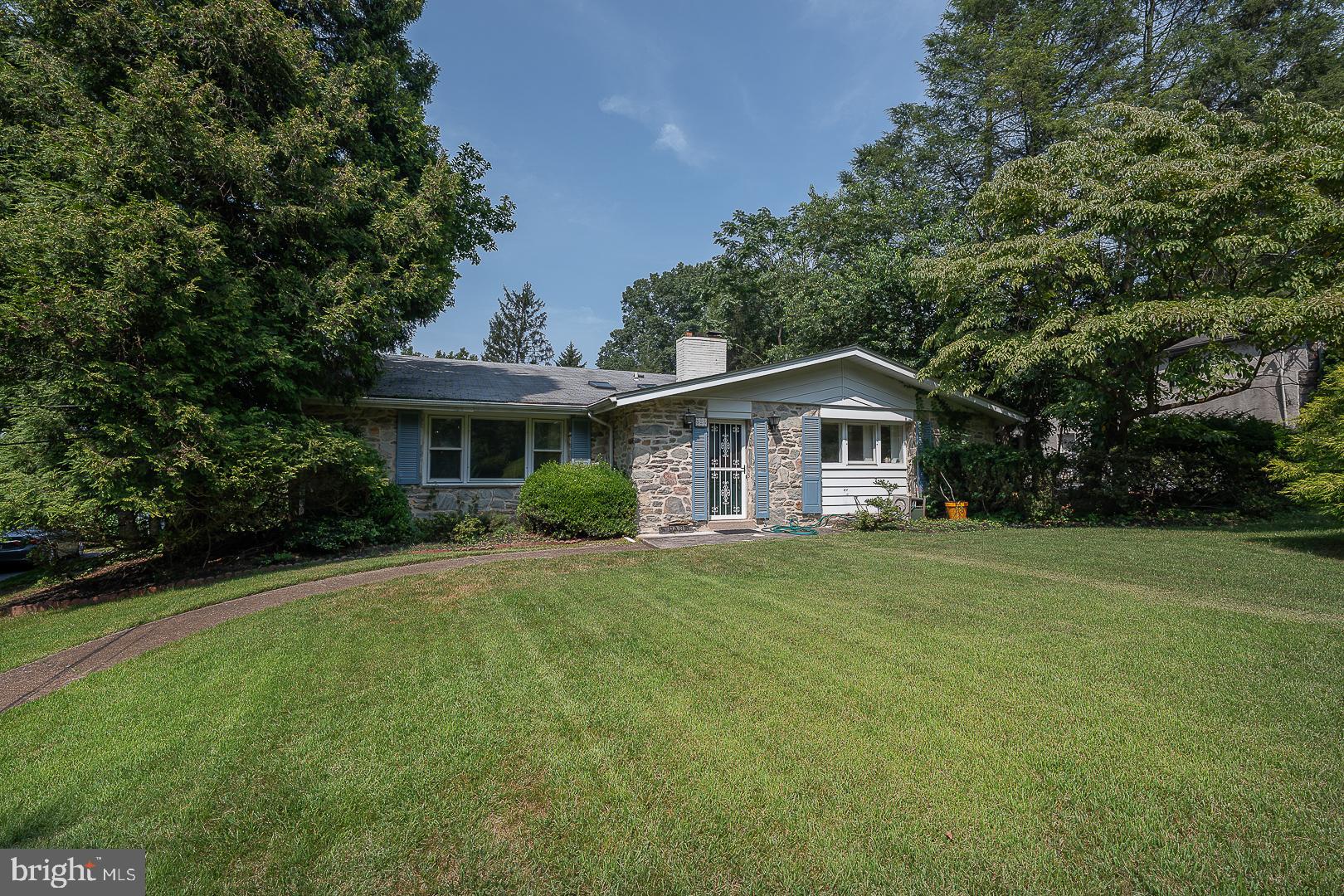 Welcome to 323 Hidden River Road in desirable Penn Valley – a spacious and beautifully maintained 5-bedroom, 3.5-bathroom home nestled on a private 1.23-acre lot in the award-winning Lower Merion School District. With over 4,100 sq ft of living space, this home offers the perfect blend of comfort, style, and function. A foyer with skylights warmly greets you upon entry, leading into a bright formal living room featuring soaring vaulted ceilings. A striking stone fireplace anchors the elegant formal dining room and connects seamlessly to the eat-in kitchen, complete with a breakfast area and convenient access to the back deck. Upstairs, the expansive primary suite includes two closets and a full ensuite bath. Three additional bedrooms and a full hall bath with double vanity and tub complete the upper level.  Down a few steps adds incredible flexibility with a spacious family room with fireplace, two bonus rooms ideal for a 5th bedroom, home office, or gym, plus a full bathroom, half bathroom, mudroom with laundry and outside access, and abundant storage throughout. Step outside to a large back deck overlooking the level backyard – perfect for entertaining, play, or simply enjoying the natural surroundings. Ideally located near major roadways for an easy commute to Center City, and just minutes from shopping, dining, and recreation.

Don’t miss this exceptional opportunity to own a move-in-ready home in one of the Main Line’s most sought-after neighborhoods!