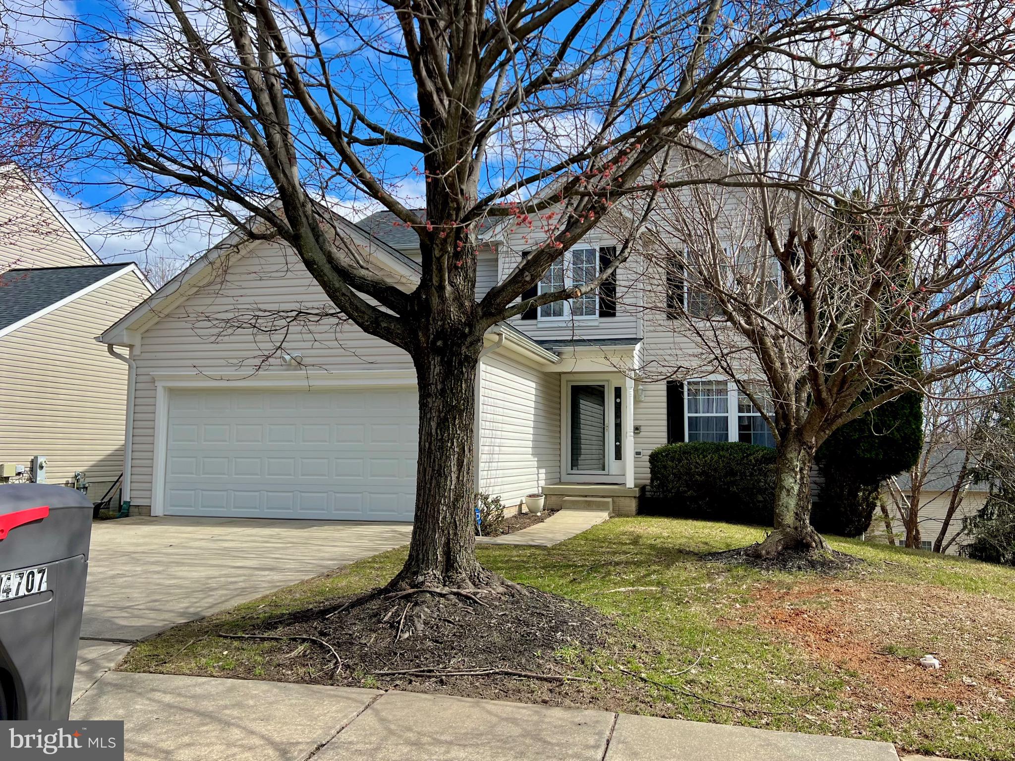 LOVELY 4BR 3 1/2 BA DETACHED COLONIAL boasts Bright & Open Floor Plan PLUS MANY ADDED FEATURES including Expanded Master Suite w/Sitting Area, Super Bath w/Whirlpool Jets, 2-tiered Deck, Eat-in Kitchen  Custom-Built Bar in basement, 2-story Foyer, Floor-to-Ceiling Stone Fireplace in Family Room, 4th bedroom in lower level, separate dining room and living room.