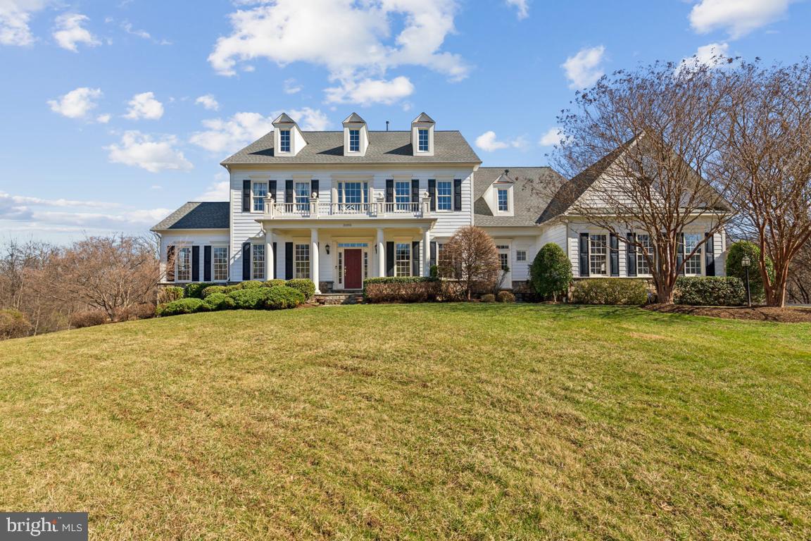 Stunning Colonial in Silcott Meadow combines gracious living and easy entertaining in a private setting. This 5 bedroom, 6 bath home with a 3-car garage is set on 4.5 premium acres on a cul-de-sac and backing to trees. Built by M/I Homes, this Augusta II model has the added benefit of a 2 -story bump out. The home features a grand 2-story foyer with a curved staircase, gleaming hardwood floors, a formal living room and large dining room with butler’s pantry, an office, sunroom and family room with a two-sided gas fireplace. Sunlight streams into the family room through a curved wall of windows. The upgraded main floor bath includes a tiled shower. The gourmet kitchen and breakfast room is a chefs delight with a large center island, granite counters and gas cooktop, double oven and two dishwashers. Off of the kitchen is a mudroom and laundry room with a separate entrance and a second stairway leading to the upstairs. The primary bedroom suite includes a sitting room, built-in bookshelves, two walk -n closets and a luxurious spa-like bathroom with soaking tub and shower. The 3 generous sized upstairs bedrooms all have their own ensuite full baths. The fully finished walk-out lower level includes a great room with gas fireplace, a kitchenette with stunning Italian granite, a 5th bedroom with full bath, exercise room, a den, storage room and utility room. Step through the French doors out onto the stone patio and the stunning custom-built fireplace. It’s a perfect place to relax, entertain and enjoy the trees, grass and nature. A 20KW Generac Generator provides extra peace of mind. NEW HVAC, NEW carpeting, NEW transom windows, newer roof (2020), hot water heater (2021), and water softener (2022). Located 5 minutes from shopping and dining in Purcellville and Catoctin Corner and 15 minutes to Middleburg. This this home has easy access to Route 7 and the bypass to Dulles Airport and Washington DC. Welcome home to the best of Virginia living!