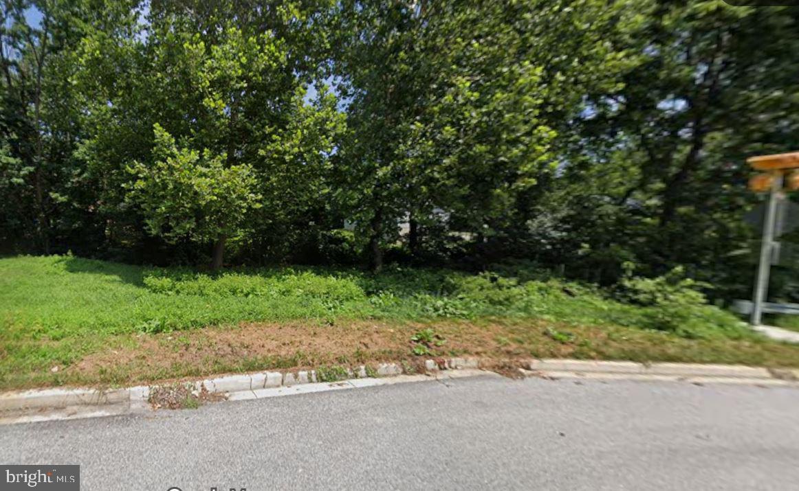 BUILD YOUR CUSTOM HOME IN HOWARD COUNTY - Discover a rare opportunity to build within an established, mature neighborhood. This unique lot is utility-ready with water, sewer, natural gas, and electricity available at the street. Per county the building site is situated on the far side of the stream, creating a distinct and tranquil setting for a future residence. Perfectly located for an easy commute to Ft. Meade, NSA, Baltimore, and Washington D.C. 
**Property sold as-is; buyer to verify all development and environmental specifics with Howard County.**