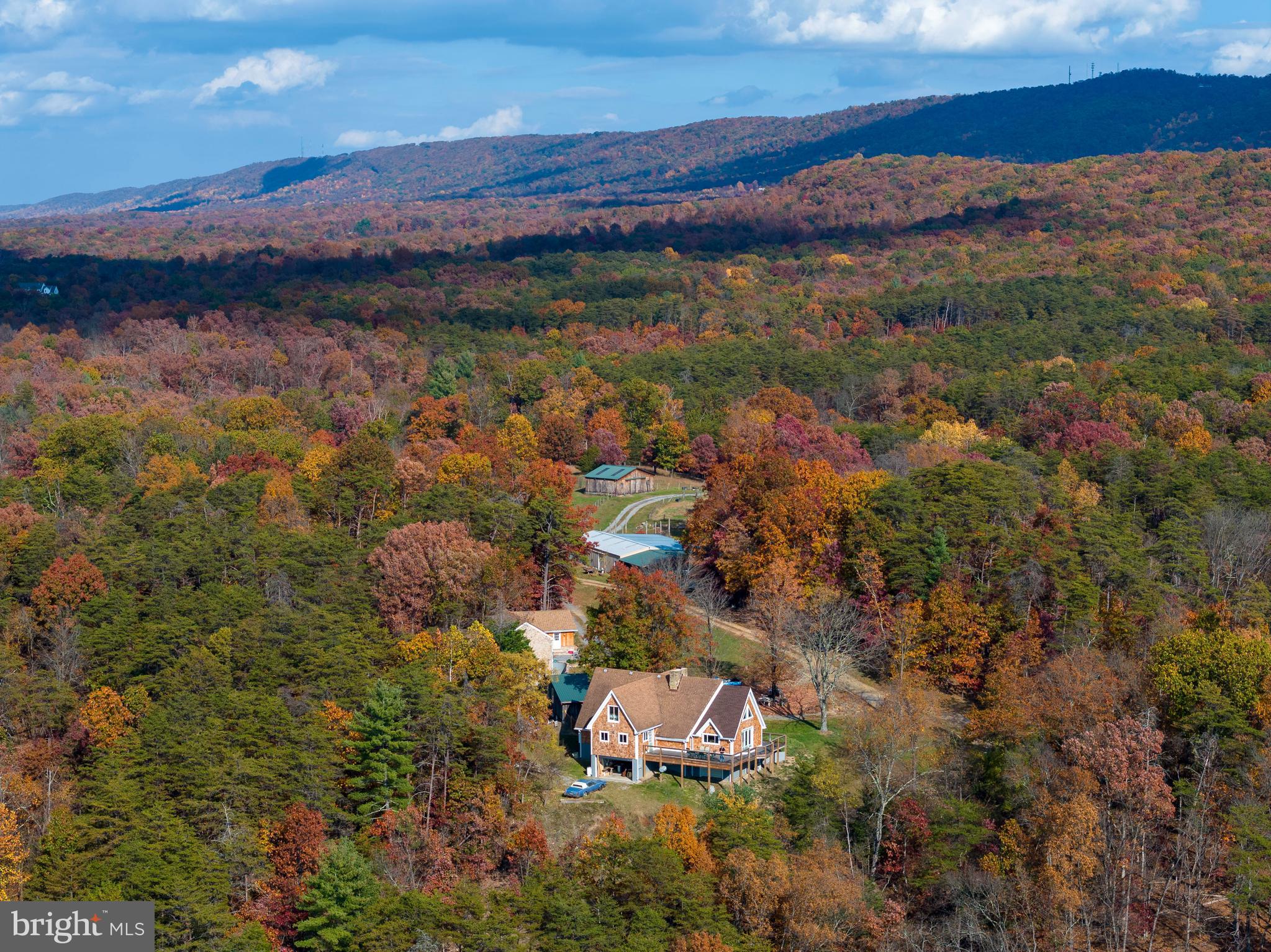 Private, Beautiful, and Convenient  Farm Estate -  70 Acres of Splendor   Commuting distance to Washington DC 

Welcome to an extraordinary property that combines natural beauty with modern convenience. Nestled on 70 acres, this highly attractive estate features a main house fully renovated in 2023, a charming guest house, barn/stables,   utility building and additional outbuildings .

Property Highlights:

    Main House: Completely renovated in 2023, offering modern amenities and comfort.
    Guest House: Perfect for visitors or additional family members.
    Barn/Stables: Ready for horses or livestock.
    Utility Building: Extra storage and utility space.
    Pond and Stream: Enjoy serene water features, with Back Creek bordering the property.
    Spectacular Views: Breathtaking mountain and valley views that provide a picturesque backdrop Sellers  Recently completed  2 additional bedrooms, one additional bath and a game/ recreation  room on the walk-out basement level.  Also great views from this level.
Land Details:

    70 Acres Total: 10 acres unrestricted, and 60 acres in farmland preservation.
    Building Sites: Four possible building sites for expansion or development.
    Fields and Water: Five fenced fields with water supply for horses or cattle, and an additional well on the 60 acres.
    Recreational Opportunities: Swim, fish, and canoe in Back Creek, which borders the property. The land is partly wooded, perfect for hunting and exploring.

Location Benefits:

    Easy Access: Close to I-81, the Virginia line, and Winchester, Virginia.
    Nearby Cities: Commuting distance to Washington DC/Baltimore Close  Proximity to Martinsburg and the MARC commuter train to DC.   
    Airports: Convenient distance to Dulles International Airport and Hagerstown Airport.
    Minutes to Martinsburg and the Marc Commuter train to DC 


Lifestyle and Opportunities:

    Equestrian and Farming: Ideal for horses, cattle, and chickens. Ample space for gardening.
    Outdoor Activities: Fish, swim, canoe, and hunt in your own backyard.
    Multifamily Living: Perfect for large families, with room for grandparents and children.
    Investment Potential: Excellent as a second home or for generating extra income as an Air B&B

   Main House : Recently completed  2 additional bedrooms, one additional bath and recreation /game room on the walk-out basement level .  Also great views from this level. Main house 5 bedrooms and 3 baths. 

Experience the exceptional privacy, stunning views, and endless possibilities this remarkable property offers. Bring your horses, cattle, and gardening shoes, and make this beautiful estate your new home.