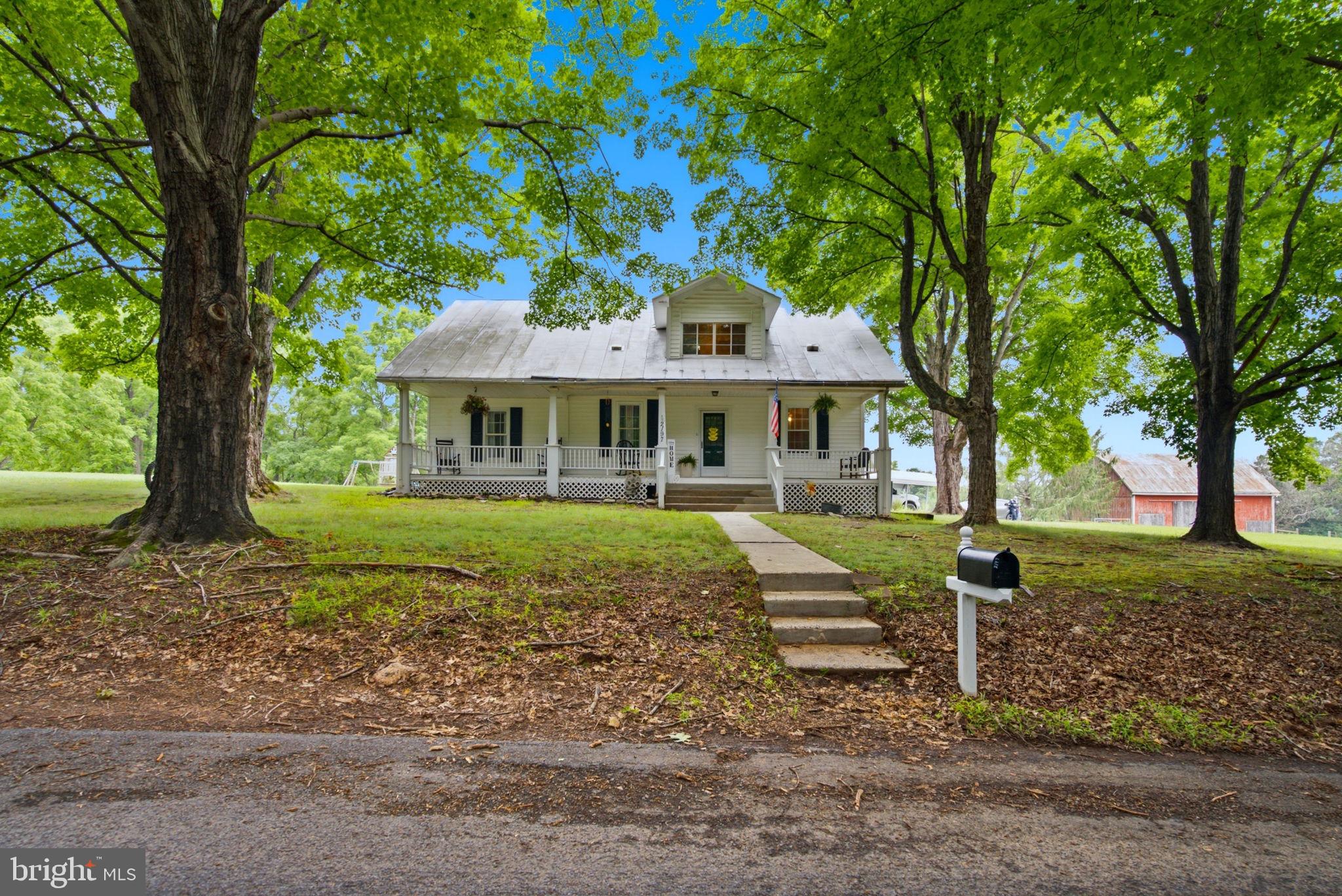 Take a ride in the country to your adorable cape cod home.  You will enjoy the peace and quiet of this lovely home on a 2-acre beautiful parcel of land. Large cape cod with large rooms with spacious closets.  Beautiful hardwood oak flooring.  Freshly painted and ready for you to move in. Jack and Jill bath on main floor to a bedroom and to the laundry room.  2 fairly new heat pumps with 2 zones and the well pump, pressure tank and hot water tank, all are less than 2 years old.  Enjoy the view from the kitchen window...or from the back porch. You can enjoy the views of the country farms from your own yard. This spacious home is located South of Berkeley Springs for easy commuting to Va. Enjoy multiple fruit trees along these beautiful open acres.