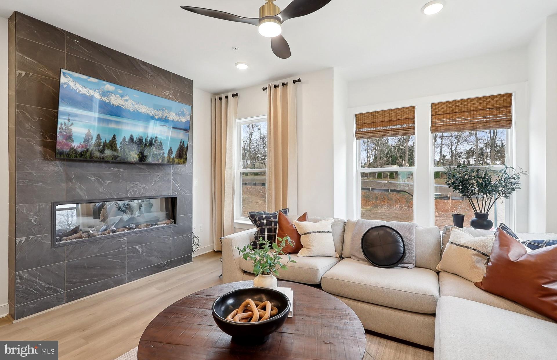 AVAILABLE NOW * MOVE-IN READY! This 4-level Baywood Way townhome features 1,791 square feet of space. Lot 04705. This is your all-in price with upgrades already included. This home offers 3 bedrooms, plus 3.5 baths, so each bedroom features its own private bathroom. A 4th floor interior loft area for an additional entertaining space, loft level bedroom with stand-up shower w/ seat, plus a 11’ x 15’-8”’ rooftop terrace for outdoor entertaining or soaking in the sun. Plus, a 2-car tandem garage. The open concept main level features a large center kitchen cascade island, Whirlpool stainless steel appliances, Calacatta Vincenza Quartz countertops, tile backsplash, and White cushion close kitchen cabinetry. The kitchen opens up to a large gathering room featuring an electric fireplace with tile accent wall.  The Primary Suite offers dual walk-in closets and on the same level you will have a spacious secondary bedroom with a spacious walk-in closet and a convenient laundry room with a washer & dryer already installed.  All Oak stairs and 7" plank flooring througout.  Just move-in and enjoy your new home! TO TOUR OUR DECORATED MODEL AND FOR MORE INFOMATION ON THIS HOME, PLEASE VISIT OUR SALES CENTER LOCATED AT - 16144 FREDERICK ROAD ROCKVILLE, MD 20850 Farmstead District in Rockville, MD is a blend of modern living while offering everything right outside your front door. Upscale community amenities await residents—a symphony of convenience and leisure. Imagine living a few blocks from the Shady Grove Metro with easy access points to I-370 and I-270, your daily commute becomes a breeze. The vibrant tapestry of 270 Center, RIO, and Downtown Crown lies just minutes away, inviting you to explore, dine, and savor life’s little pleasures. But it’s not just about proximity; it’s about the rhythm of everyday living. Take a leisurely stroll to Upper Rock Circle, where culinary delights await. Cava, CVS, Mom’s Organic Market, Nums Yums Bakery, Safeway, Coffee republic, Botanero Wine Bar, Nagoya Sushi, and Firehouse Subs. Just outside, you are steps from pickleball, tennis, basketball, the dog park and everything J. T. Stepanek park has to offer! But wait, there’s more—a hidden gem that ties it all together. The Barn, Farmstead District’s community center, offers a modern fitness center, seasonal pool, fire pit, grills, and multiple seating areas. With room for year-round entertaining, the Barn is designed to elevate your everyday living experience