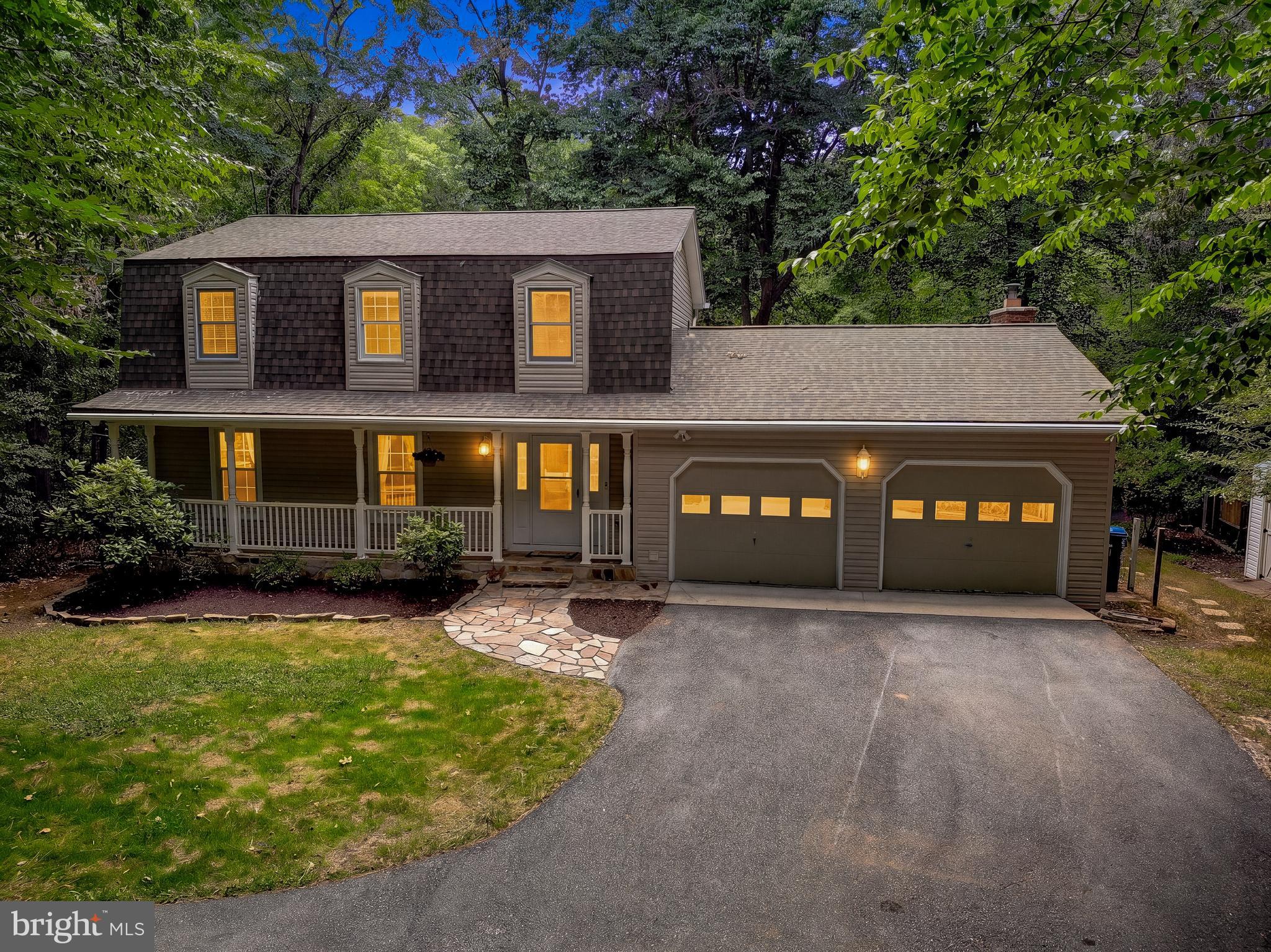 Secluded 3.2-Acre Wooded Retreat with Water Access in Dunkirk!
Welcome to 10410 Three Doctors Road, a beautifully maintained 4-bedroom, 2.5-bathroom sanctuary tucked away in a quiet cul-de-sac within the water-privileged community of Ferry Landing Woods.

Step inside to a traditional layout defined by warm wood flooring and bright, light-filled living spaces. Your fabulous kitchen is located in the center of the home with ample counter space for entertaining. The upper level hosts four generous bedrooms, each enveloped with views of nature. With two fireplaces, a dedicated mudroom, and a large unfinished basement, this floor plan adapts perfectly to your lifestyle.  Welcome the new day in your sunroom with wrap-around windows offer panoramic views of your wooded acreage. Step off your large deck into an outdoor space designed for pure enjoyment.  Enjoy the gentle sounds of your backyard pond, gather around the fire pit, read a book on your hammock, or grab daily fresh eggs from your chicken coop.
It is rare that a home offering this level of total peace and tranquility comes to the market—especially with such convenient access to commuter routes and everyday shopping.