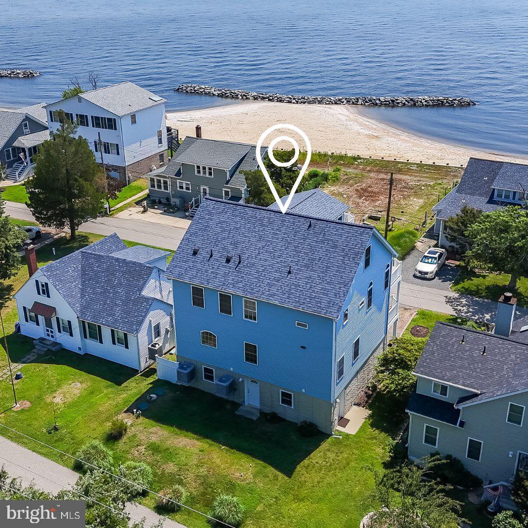 If you can live anywhere, why not live with water views, your own community beach and beautiful sunrises everyday?  Looking for a beach lifestyle without Bay Bridge traffic? This stunning Waterview home in Huntingtown offers access to a private beach on the Chesapeake Bay with convenient water access just across the street. Featuring over 4,000 square feet, this property is ideal as a second home, vacation home, or potential multi-family retreat. Enjoy breathtaking waterfront-style views from all four levels, with 4 bedrooms including 3 with en-suite baths. Multiple decks off the primary suite, bedrooms, kitchen, and upper level capture the beauty of the Bay. The lower level is designed for beach living with a private entrance, rinse area, half bath, and wet bar. Additional features include a two-car garage, fresh interior paint, elevator shaft for future installation, community beach access (3 entrances), and a rentable clubhouse. Conveniently located under an hour to Washington, DC, Alexandria, and within easy reach of Annapolis. Located 10 minutes from Chesapeake Beach & North Beach! A perfect opportunity to enjoy relaxed Chesapeake Bay waterfront living without the commute. Two car garage gives you lots of parking space and the driveway will accommodate 3 additional cars easily.  One of the most beautiful beaches in Calvert County.  You have to see it to experience the tranquility and peacefulness of this special hidden retreat  on the Chesapeake Bay. Don't let the season pass you by when you could enjoy living at the beach!