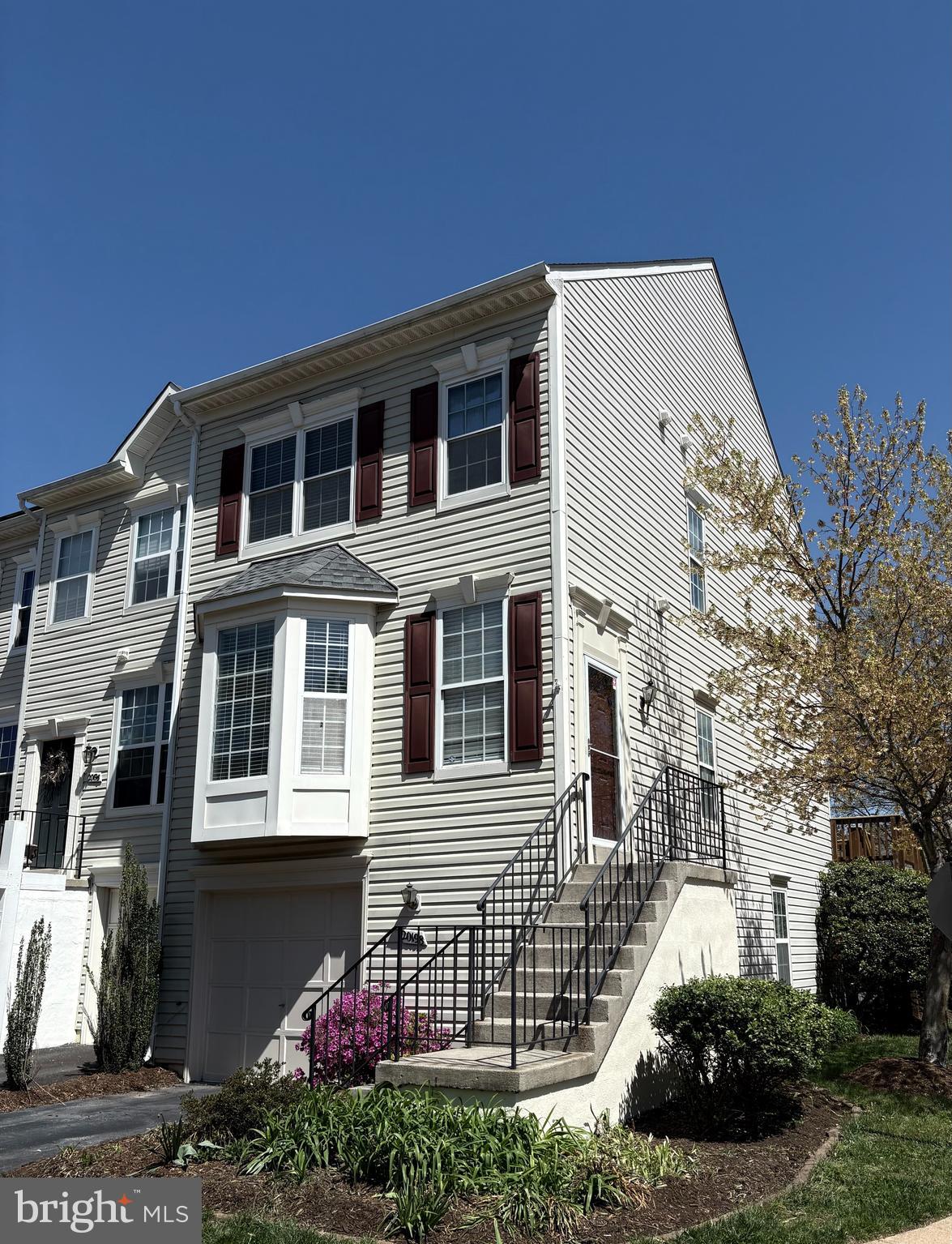 Bright, End-Unit Townhome in Prime Ashburn Location!

Welcome to this beautifully updated and sun-filled end-unit townhome, ideally situated in one of Ashburn’s most conveniently located communities! Just minutes from Route 7 and Route 28, commuting is a breeze—plus, you’ll enjoy being just moments from the vibrant shops, dining, and entertainment at One Loudoun, as well as outdoor escapes like the Potomac River and Algonkian Park.

Inside, this home impresses with gleaming hardwood floors, fresh paint throughout, brand-new carpet, updated lighting, and a bright, open floor plan. The main level features a spacious living area with recessed lighting and kitchen complete with granite countertops, stainless steel appliances, and access to a large, newly updated deck—perfect for morning coffee or evening gatherings. Stairs from the deck lead down to the backyard and beautiful paver patio, ideal for entertaining.

Upstairs, you'll find two generously sized bedrooms, each with its own en-suite bathroom and ample closet space. The walk-out lower level offers a cozy family room with a gas fireplace framed by custom built-ins, plus access to the inviting backyard patio.

Additional highlights include a freshly painted garage—floor included—with plenty of storage space, plus abundant visitor parking nearby.

Don’t miss this turn-key gem in a location that truly has it all!