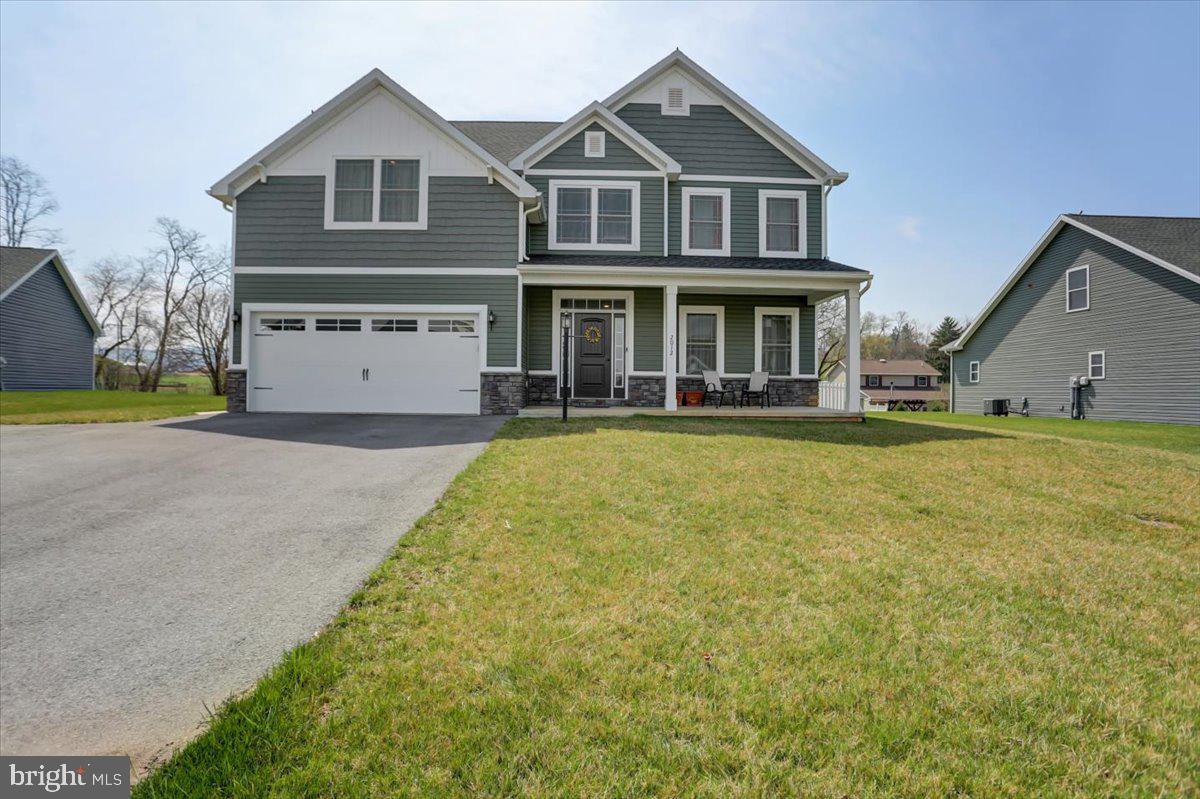 Welcome to Southwood Crossing!This gorgeous two-story colonial, just built in 2019, was originally a spec home for the builder and comes with all the desired upgrades you could want. With only one owner, it has been well maintained and is ready for you to move in and make your own. This home boasts a spacious and modern layout with an open floor plan, making it perfect for entertaining guests, holiday parties or your favorite sporting events. As you enter the home, you'll notice the stunning 9-foot ceilings and crown molding, wainscoting, and rot iron railing that add to the character you've been searching for! The open-concept kitchen, dining and living room areas are warm and welcoming. The kitchen invites you in with beautiful granite countertops and plenty of ample cabinet space. Upstairs, you'll find four spacious bedrooms, including an oversized master suite with a tray ceiling, walk-in closet and extra space that would be perfect for a desk or spin bike. The master bathroom features a soaking tub and separate shower, dual vanities and tile floor. Enjoy the beautiful outdoors with a spacious 20 x 16 covered rear patio, perfect for relaxing and entertaining. The fenced backyard provides separation and a safe place for children and pets to play, with an elevated lot that sits up above the neighboring property behind the house. Other features of this stunning home include a two-car attached garage, ample basement storage space with a potential to be finished for additional square footage, and easy access to nearby shopping, dining, and entertainment. Don't miss out on the opportunity to make this beautiful home yours!