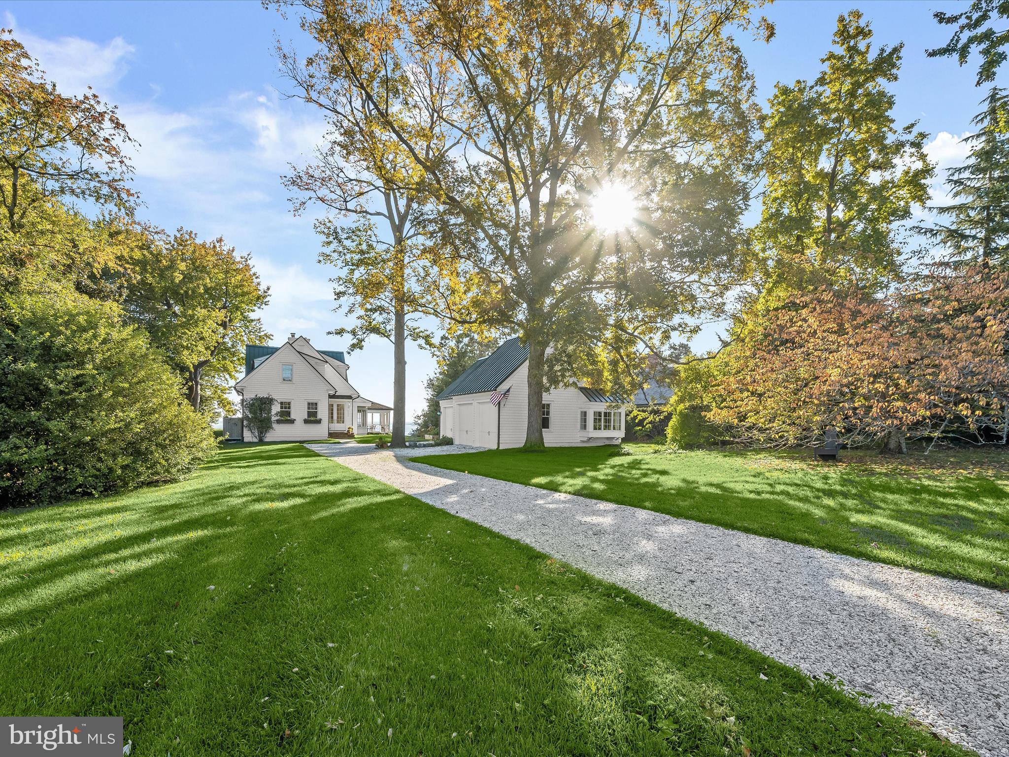 Nestled on Gibson Island overlooking the Chesapeake Bay and the Gibson Island Golf course is a simply
exquisite, turnkey, white shingle cottage. Completely rebuilt in 2020, this extraordinary three bedroom,
three bath, two half-bath property offers an enchanting nod to many of its original features. Inspired by
the original 1925 cottage, the custom house is built with meticulous attention to detail using only the
finest materials and top-of-the-line craftsmanship.
Glorious sunrises from virtually every room rise over continuous honey-colored quarter-sawn oak floors.
The magnificent eat-in gourmet kitchen will delight any serious chef. Relax by the fire in the large,
beamed Great Room overlooking the Chesapeake Bay. The Great Room’s eastern wall opens completely
to the large Ipe deck where spectacular views and the gentle break of the waves are enjoyed. The
screened porch off the Great Room offers plenty of space, cool breezes, and more spectacular water
views. A stunning ensuite bedroom/office is located on the main level.
Upstairs is a primary suite with jaw dropping views of the Bay, another spectacular ensuite bedroom,
and a thoughtfully designed laundry room. A matching auxiliary building on the property can
accommodate multiple cars, offering a two-door bay, a one-door bay, a fabulous potting room, a second half bath in addition to the one in the main house, and two sinks.
Sitting up high from the Chesapeake Bay and back from the road with golf course views, the house has a
basement, is equipped with a whole house generator and an outdoor shower and has
geothermal heat. This very special property is a five-minute stroll to the Gibson Island Club.

Information on Gibson Island:

Gibson Island is a private island within one hour of Washington, D.C. and Baltimore offering an absolutely extraordinary setting.  The Island comprises 1000 acres with seven miles of shoreline. Two thirds of the Island is undeveloped and is owned by the Gibson Island Corporation, the homeowners' association.  The remaining third is residential home sites. 

Gibson Island is located on the western shore of Maryland, so there is no need to cross the Bay Bridge. On the Island is a 43-acre spring fed freshwater lake in which one may enjoy non-motorized watercraft activities such as paddleboarding, canoeing, kayaking, fishing and swimming.  

The Island offers enormous privacy and security--there is an entry gatehouse staffed 24+Hours and the Island is patrolled by the Gibson Island Police Force (GIPD).  The Gibson Island Corporation Service Department offers yard maintenance and landscaping and other services for homeowners.  There is a full-service yacht yard.   From the Island, it is just a 20-minute drive to BWI Airport and the neighboring Amtrak train station.  

The Island houses a private country club (membership by invitation) offering yachting, fine dining year-round, tennis, an award-winning Charles Blair Macdonald designed 9-hole golf course, swimming, croquet, skeet shooting, and more.  (C)