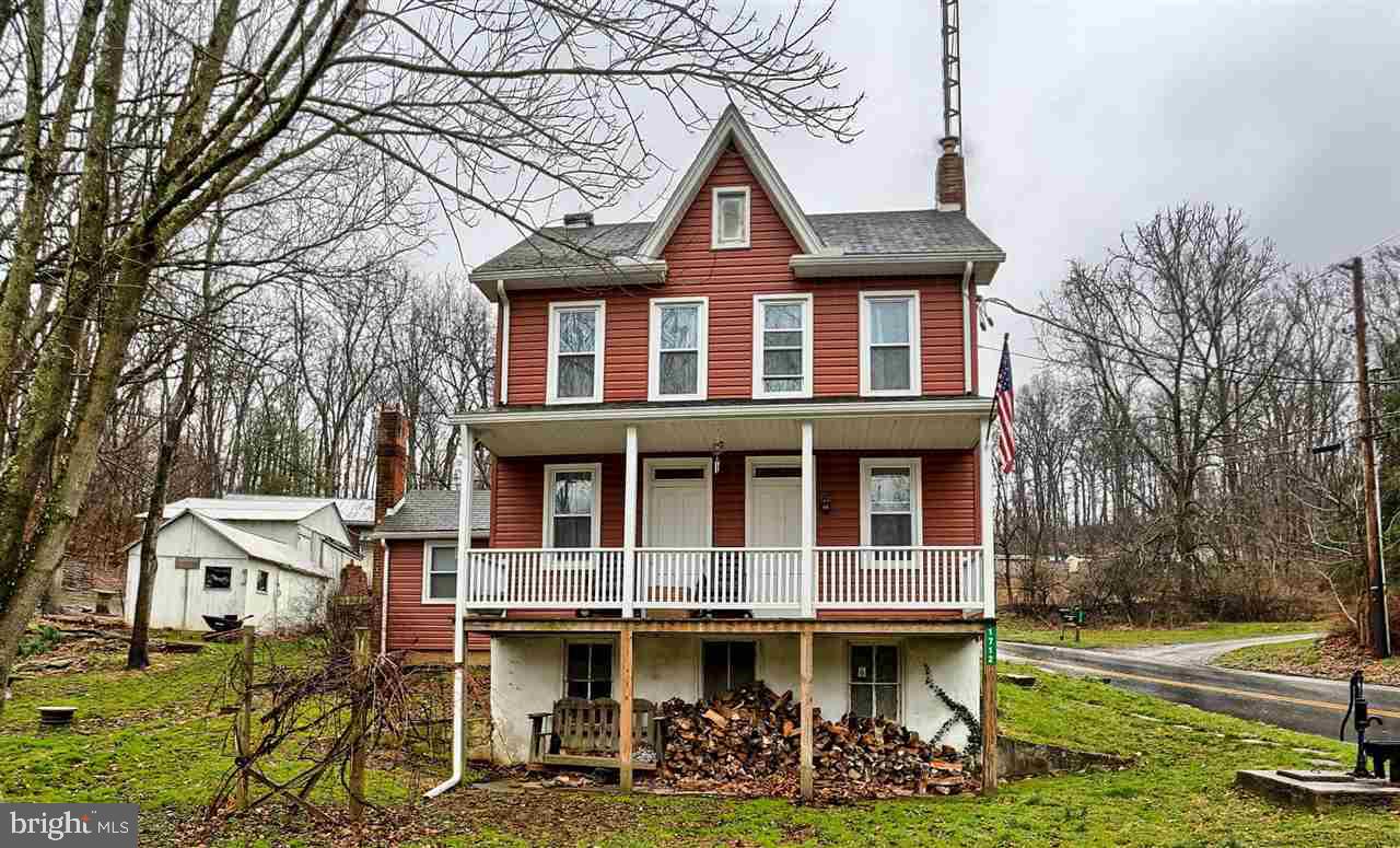 New Price!  Don't miss out...a home on 7+ acres for this price? Sit on the front porch and overlook the stream below, find a spot for your tree stand, bring your animals...or all three!  You decide!  This home features newer drywall, insulation, chimney liner, windows, siding and updated electric!  All appliances and wood stove included! The detached garage has electric and attic storage!  Schedule your tour today!
