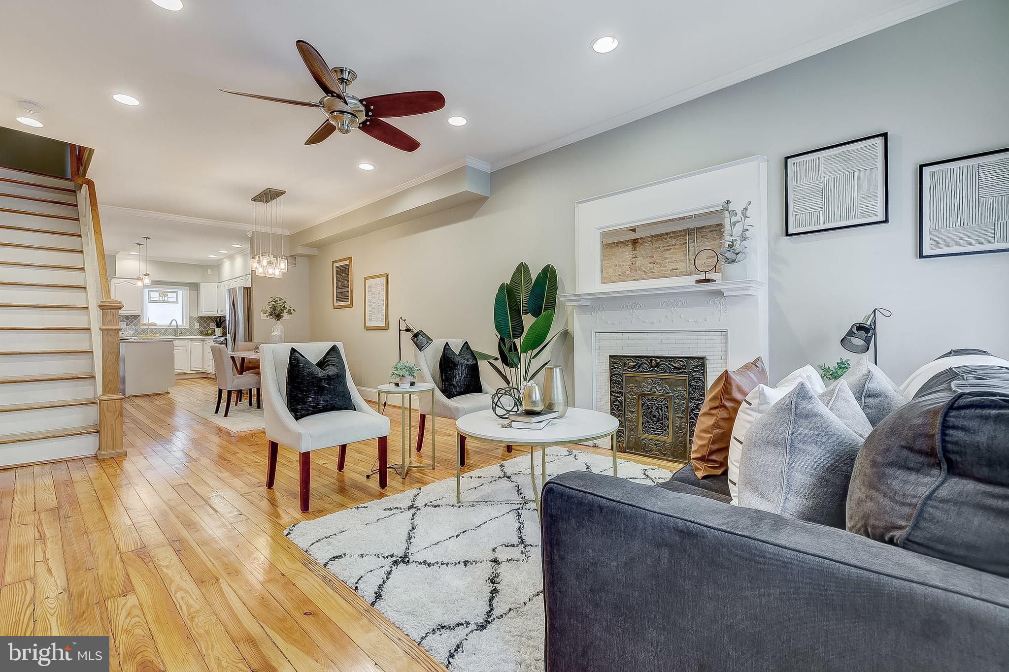 STUNNING 3 STORY HOME LOCATED ON SOUGHT AFTER BLOCK IN CANTON WITH WITH OFF-STREET PARKING PAD. OVERSIZED LOT WITH 2,000+ SQUARE FEET. GORGEOUS RECLAIMED HARDWOODS CASCADE THROUGHOUT. ENJOY WHITE CABINETRY, UPGRADED TRIM AND PAINT PACKAGE, IMPORTED TILE, QUARTZ COUNTERTOPS, SS APPLIANCES IN DESIGNER CHEF'S KITCHEN. LOADS OF NATURAL LIGHT. HIGH CEILINGS. EXPOSED BRICK. TONS OF STORAGE. WALK-IN SHOWERS. WALK-IN CLOSETS. FINISHED LOWER LEVEL. SPACIOUS 4 BEDROOMS WITH 3.5 BATHROOMS. 3RD LEVEL ROOM CAN ACT AS A LIBRARY, STUDY, GYM, OFFICE, OR SECONDARY GREAT ROOM. EXPANSIVE DECK WITH BREATHTAKING VIEWS OF CITY SKYLINE - GREAT FOR ENTERTAINING. DUAL ZONE HEAT/AC. CLOSE PROXIMITY TO RETAIL SHOPPING, LOCAL DINING, PATTERSON PARK, AND ALL MAJOR HIGHWAYS.