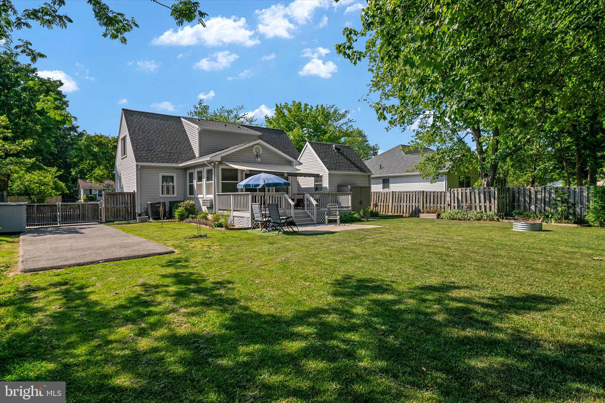 Tucked away in the peaceful Cloverfields community, this beautifully updated Cape Cod with sunroom and second floor addition blends classic charm with modern comfort. Nearly every inch of the home has been renovated, including a full interior remodel, brand-new kitchen and bathrooms, two added full baths (for a total of four!), new flooring, lighting, paint, windows, roof, skylights, HVAC systems, exterior doors, and more. There’s even a new second laundry room, front porch, paved driveway extension, encapsulated crawlspace, privacy landscaping, and custom closet system.
The property also includes two storage sheds, one with electricity — perfect for a workshop, hobby space, or she-shed.

Inside, the open floor plan creates an inviting space that’s great for both everyday living and entertaining. The family room feels warm and welcoming with recessed lighting and a cozy electric fireplace. The kitchen is designed for both style and function with custom storage, granite countertops, ample table space, a pantry, and ENERGY STAR appliances.

The home offers three spacious bedrooms, including a relaxing primary suite with a spa-like bathroom. Extras like wainscoting, skylights, and main level bedroom add even more comfort and character throughout the home.

Outside, the level 0.34-acre lot offers plenty of room to enjoy the outdoors, whether you’re relaxing on the large deck and patio or hosting friends and family. And the location is hard to beat — just four blocks from the Chester River with access to amazing Cloverfields amenities including a community pool, beach, basketball courts, boat ramp, boat slips, playgrounds, and scenic trails.

This home offers the perfect mix of modern updates, outdoor living, and laid-back community charm — truly a place you’ll love coming home to.