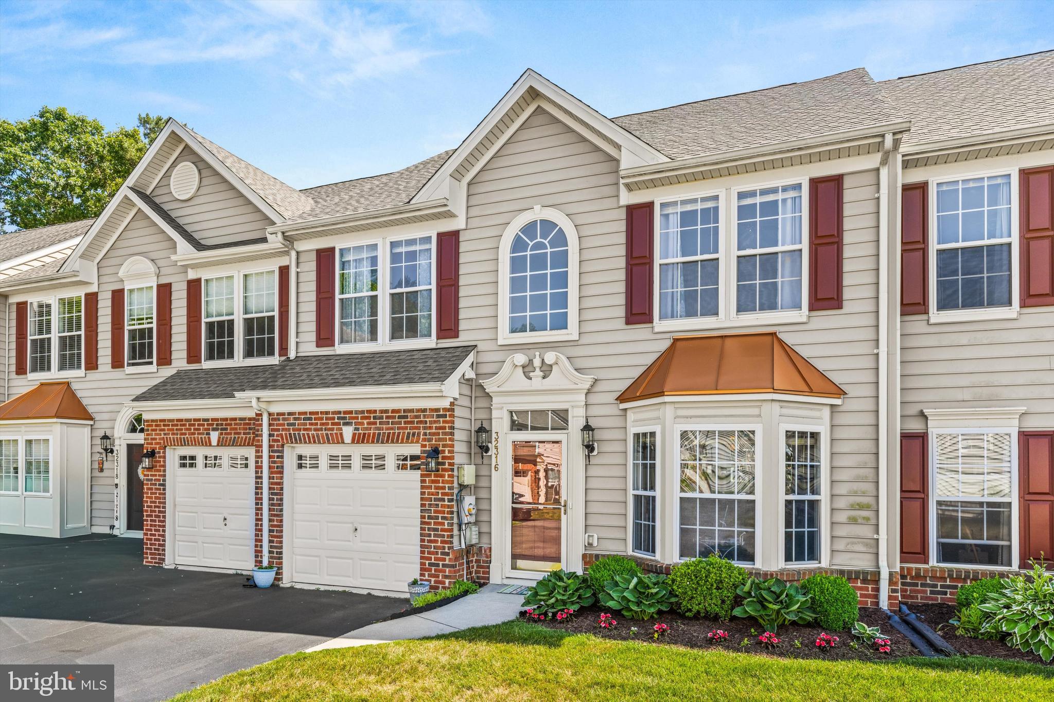 Welcome to this beautifully updated two-story townhome offering the perfect blend of comfort, style, and functionality. This spacious 3-bedroom, 2.5-bath home features an inviting open floor plan designed for both everyday living and entertaining. The main level showcases a stunning vaulted ceiling that enhances the living room and dining area, while expansive windows fill the space with natural light. The updated kitchen offers modern finishes and flows seamlessly into the main living areas. Updated flooring throughout adds a fresh, contemporary feel. Convenient first-floor living includes a spacious primary suite complete with a private bath and a large walk-in closet, as well as a laundry area and powder room for guests. Upstairs, you'll find a versatile loft space, two generously sized bedrooms, a full bathroom, and a dedicated storage room. Abundant storage throughout the home provides plenty of space for organization and everyday convenience. Enjoy outdoor living on the spacious rear patio, perfect for relaxing or entertaining, along with the convenience of an attached garage. This move-in ready home combines thoughtful updates, exceptional storage, and an ideal layout in a desirable Millsboro location.