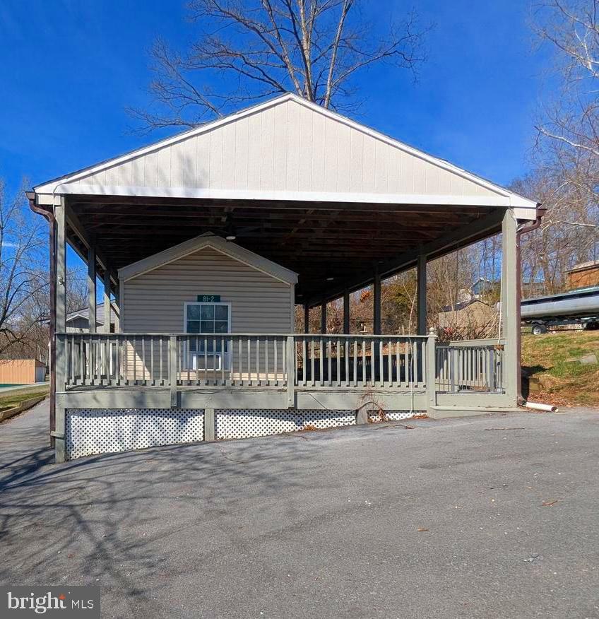 Discover this fantastic location featuring a tiny home. The deck and tiny home are fully covered by a pavilion, and the deck is enclosed, making it perfect for your pets or children. This one-bedroom home comes with all the amenities you would expect in a traditional house. Make your appointment today.  

Get ready to embrace the river lifestyle! This gated community requires entry through the guard shack with proper ID for a visitor pass. Open seasonally from April 1 to November 1, River Bend is a privately-owned 400-acre RV resort on the Upper Potomac River in West Virginia, offering seasonal activities for members, families, and guests. Just a short drive from the Washington and Baltimore metro areas, it features utilities during the open season but grants lot owners year-round access. Members enjoy scenic views, wildlife, river access, trails, pools, mini-golf, sports courts, a youth center, laundry facilities, convenience store, lounge, bathhouses, boat ramp, bar and grill, and even a church. Seasonal events include fireworks, carnivals, bonfires, poker runs, tournaments, car shows, Halloween festivities, and more. Come see this fantastic lot and make it your getaway spot!