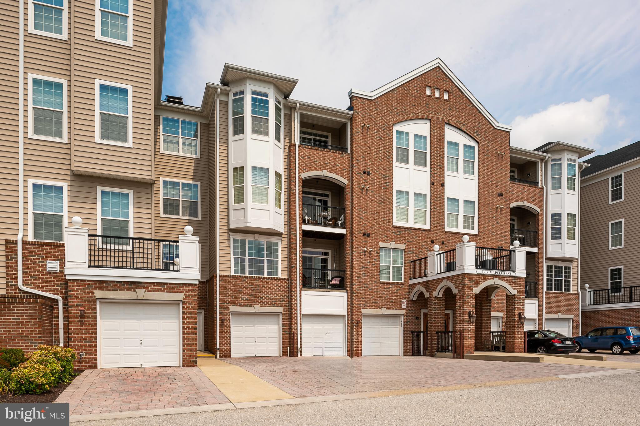Your lucky day has arrived - super popular Gatherings at Lyndwood 55+ community - this TOP FLOOR corner Dogwood model is flooded with natural light & includes an in building oversized garage (plus 2 vehicle parking in your own driveway) and a separate, amazing, coveted storage room too! Downsizing into this gem will be a breeze - enjoy the eat in kitchen with granite counters, corner windows, stainless steel appliances, & a pantry; the central living room is a great place to relax & entertain; the versatile layout also includes a sunroom & a formal dining room + a den with custom built ins & two bedrooms & 2 fulls baths. The generously sized primary suite has a walk in closet with custom storage system & luxury bath too. Rest easy knowing the heating & cooling system and gas water heater were replaced in 2020. The great community clubhouse & amenities (pool, tennis, pickleball, gym, & gathering spaces) is just a quick stroll across the street - a perfect place to socialize with neighbors & enjoy the great life here in the Gatherings!