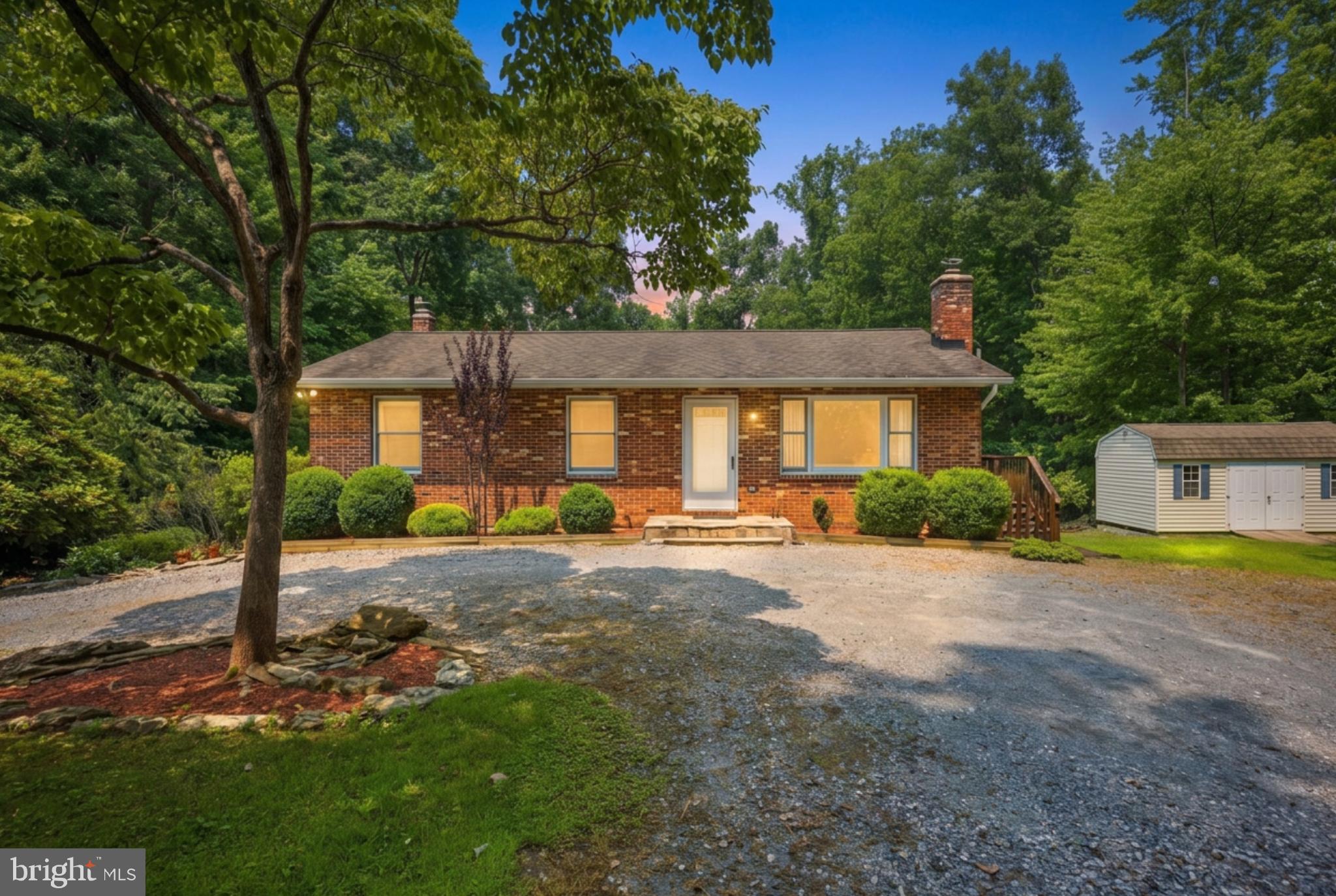 Tucked away at the end of a quiet cul-de-sac in sought-after Finksburg, this cherished, immaculately maintained rancher strikes the perfect blend of privacy, modern updates, and everyday convenience on 1.35 scenic acres. A tree-lined driveway welcomes you to a peaceful setting surrounded by mature, healthy trees, with a gently flowing stream at the rear of the property creating your own private retreat. This home offers a perfect balance of tranquility and convenient accessibility, situated just minutes from Westminster, Route 140, shopping, dining, schools, parks, and major commuter routes.

Offering over 2,000 square feet of finished living space, this thoughtfully updated home combines the convenience of main-level living with flexible spaces. The main level features three bedrooms, including a comfortable primary suite with two closets and an updated private bath. New luxury vinyl plank flooring extends throughout all three bedrooms, while beautifully updated bathrooms add a fresh, modern feel. The inviting living room showcases soaring cathedral ceilings, stunning herringbone hardwood flooring, and a dramatic floor-to-ceiling natural stone accent wall with a stone hearth ready for a wood stove. The spacious eat-in kitchen is ideal for both everyday living and entertaining, offering cathedral ceilings, abundant cabinet space, an oversized pantry, newer stainless steel appliances, and sliding doors leading to the expansive wraparound deck overlooking the private backyard.

The walkout basement extends the living space, offering exceptional versatility with a spacious family room centered around a second striking natural stone accent wall and a cozy wood stove with a brick hearth. An additional finished flex room is perfect for a home office, guest room, fitness area, hobby space, or playroom. The laundry room and bathroom are both brightened by beautiful tile work. 
Step outside and enjoy your own outdoor oasis. The expansive wraparound deck overlooks a generous backyard with mature landscaping, open green space, and a picturesque stream, creating the perfect setting for entertaining, gardening, relaxing, or simply enjoying nature year-round.

Significant recent improvements provide added value and peace of mind, including a new water heater, water softener, neutralizer, and well pressure tank (2022), upgraded septic piping (2023), Ethernet wiring to two bedrooms (2023), newer stainless steel kitchen appliances (Dec. 2023), updated bathrooms (2022), new luxury vinyl plank flooring throughout the bedrooms (2022), new LG washer and dryer (2022), and new sliding doors in the basement (2022). Additional highlights include a 40-year architectural shingle roof with a transferable warranty, a radon mitigation system, and an oversized storage shed.

If you've been searching for a move-in ready home in Carroll County that offers main-level living, a finished walkout basement, abundant outdoor living space, and the rare combination of privacy, character, and convenience, this exceptional Finksburg property is one you won't want to miss.