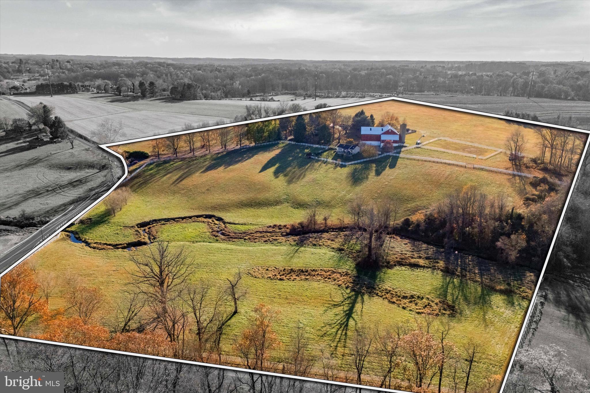 Nestled amidst 29 acres of rolling countryside, Twin Chimneys is a rare gem—a premier equestrian and multi-use estate blending historical charm with modern luxury. This exceptional property boasts a circa-1762 Federal-style manor house, guest house, 2-story bank barn, expansive grounds, and an array of amenities that elevate rural living to a refined art form.  

At the heart of the estate stands the stately main residence, offering six bedrooms and three and a half baths. This property was originally a two story stone farmhouse, built in 1790. In the 1800’s the three story brick post federal house was built. The bricks for this project were kilned on the property, near a large sycamore tree beside the White Clay Creek that wanders through the property. The twin brick chimneys were a functional necessity when built, and still adorn the home today. 

Step inside modern day Twin Chimney, to the grand center hall, where timeless elegance greets you. The large open foyer is flanked by a formal dining room equipped with a built-in butlers pantry and a sizable living room with a detailed, wood-burning fireplace. The living room lends access through double doors to a cozy sitting room. Tucked lovingly away is the parlor with a timeless, staple wood burning fireplace and the original keeping room, a historic centerpiece, featuring an oversized hearth that once served as the home’s culinary hub, now a captivating nod to the past. 

The main level seamlessly combines old-world charm with thoughtful modern upgrades. The open-concept kitchen, renovated in 2008, is a chef’s dream with custom butternut cabinetry, an AGA oven, a Sub-Zero refrigerator, a built-in steamer, and an espresso machine, and now features a breakfast nook addition. The airy family room features a stunning cathedral ceiling, skylights, a floor-to-ceiling stone fireplace, and opens through French doors to a spectacular outdoor oasis.

The pool area is paved in Pennsylvania bluestone and features a hot tub and a gazebo, perfect for entertaining or serene relaxation. A nearby fire pit and second gazebo overlook the scenic vistas, offering an ideal setting for sunset gatherings.  

The second floor of the home boasts a luxurious primary bedroom wing. This includes a private sitting area, fireplace, access to a wet bar and intimate balcony with sweeping views. Additional bedrooms, including a converted office and laundry space, ensure ample flexibility for family and guests. The third floor features a custom dressing room and two additional bedrooms, while a walk-up attic on the fourth level provides generous storage.  

Just steps from the main house, a remarkable 5,000+ square-foot bank barn invites endless possibilities. With six oversized stalls and equipped with water and electricity, the barn is ideal for equestrian pursuits. Its loft, overlooking the picturesque landscape, is perfect for hosting grand events or celebrations.

Outbuildings include a charming three-bedroom guest house that offers comfortable accommodations for visitors or staff, while the surrounding grounds include many fenced pastures, run-in shed, a springhouse, gardens, and soft rolling landscape overlooking its own portion of White Clay Creek.

Conveniently located near shopping and amenities and offering easy access to Route 1, I-95, and major hubs like Wilmington, Philadelphia, and Baltimore, Twin Chimneys is as accessible as it is enchanting.  

This extraordinary estate is more than a home—it’s a legacy waiting to be passed down. Additional acreage is available for those seeking even greater opportunity. Schedule your private tour today to experience Twin Chimneys’ unmatched beauty and versatility. Additional adjacent 28+/- acres available with sale of current parcel, totaling approximately 56 acres of contiguous land.