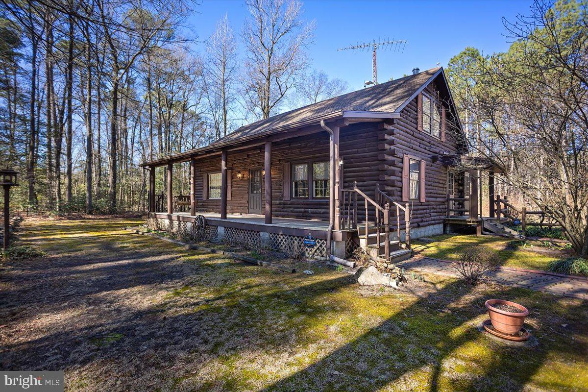 Welcome to your dream cabin! This stunning log cabin and two car garage are situated on over 17 wooded acres. Large welcoming front porch with an equally large enclosed rear porch. Inside you will find several areas for seating and entertaining. Interior walls are also logs. Three bedrooms and 2 bathrooms.