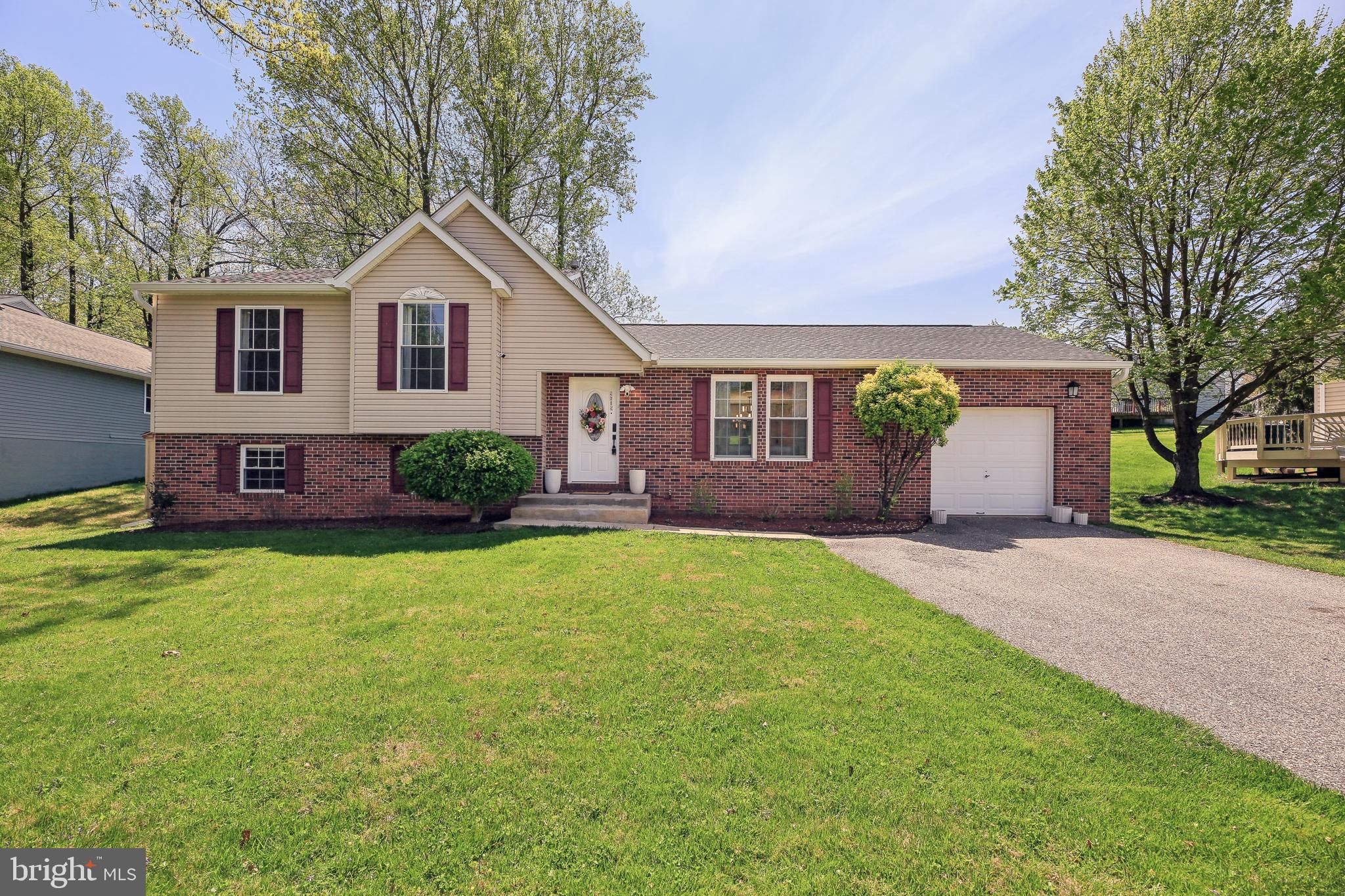 Welcome to 9619 Brie Road, where space, comfort, and flexibility come together in the sought-after Woods of Winands community. This 5-bedroom, 3-bath split-level home sits on a quiet street and offers a smart four-level layout designed to adapt to your lifestyle—whether you're working from home, hosting guests, or simply looking for room to spread out.

The main level features gleaming hardwood floors, spacious living and dining areas filled with natural light, and a well-equipped kitchen with ample counter space and modern appliances. Sliding glass doors lead to a raised patio in the backyard—perfect for outdoor dining, gardening, or enjoying a peaceful moment in your private green space.

Upstairs, three comfortable bedrooms include a generously sized primary suite, while the finished lower levels offer exceptional versatility. A cozy den leads to a walk-out basement featuring a home office, a bonus room ideal for a gym or guest space, and a large storage area to keep everything organized and out of sight.

Additional highlights include an attached one-car garage, a wide driveway, and a backyard shed for extra storage. With a prime location close to shopping, parks, schools, and major commuter routes, this home delivers the perfect balance of everyday convenience and peaceful neighborhood charm.

9619 Brie Road is move-in ready and packed with possibilities—schedule your visit today and discover all that it has to offer.
