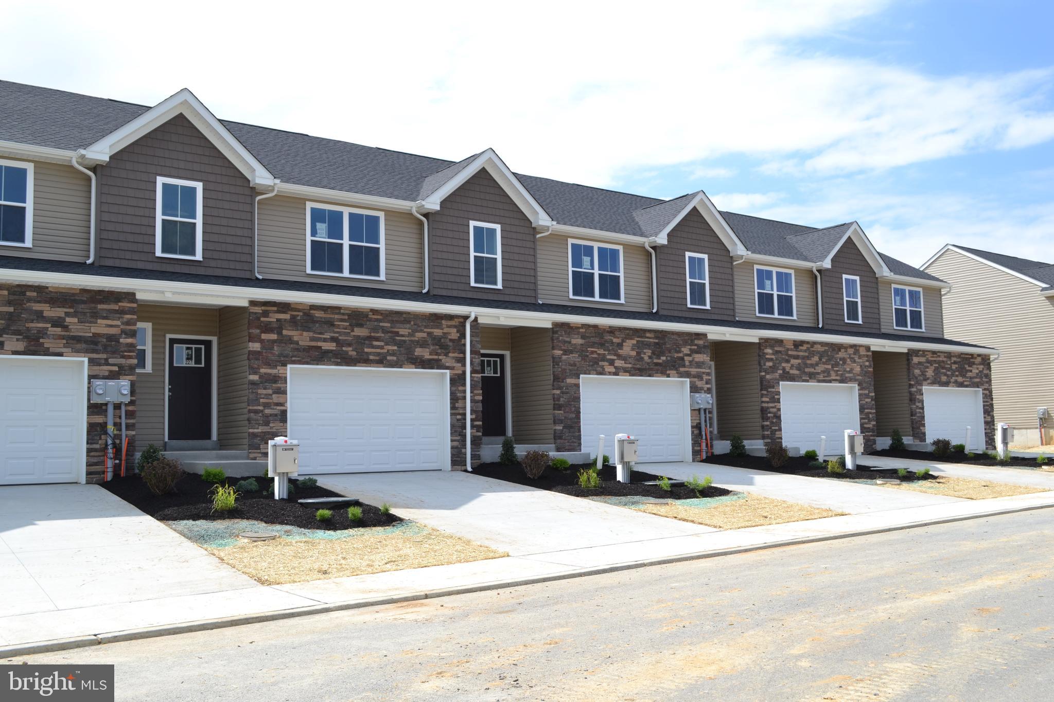 3%  BUILDER CREDIT now offered on new construction Hawkstone Village Townhomes in Fleetwood!  The heart of the home features a stunning, upgraded kitchen with white cabinets, quartz countertops, and a center island — perfectly connected to the dining and living spaces for easy entertaining or cozy nights in.  The open living spaces is a wide open, soaring great room with vaulted ceilings that instantly feels bright, airy, and welcoming.  Rear sliders lead to composite decks or concrete patios, depending on grade.  Upstairs, the spacious primary suite is your private retreat, complete with a primary bath with double bowl vanity and a walk-in closet big enough to impress. Two additional bedrooms, a full bath, and an oversized linen closet offer space for everyone.  These townhomes are designed with three professionally designed color palettes — so whether your style is bold, warm, or cool and modern, there’s an Addison that fits your vibe. Plus, this is truly low-maintenance living — the HOA takes care of lawn care and snow removal. Pair that with an oversized one-car garage and a location in charming Fleetwood, and you’ve got the ultimate in carefree, luxury townhome living.  One more thing...backed by the one-year Builder Warranty, we've got you covered!