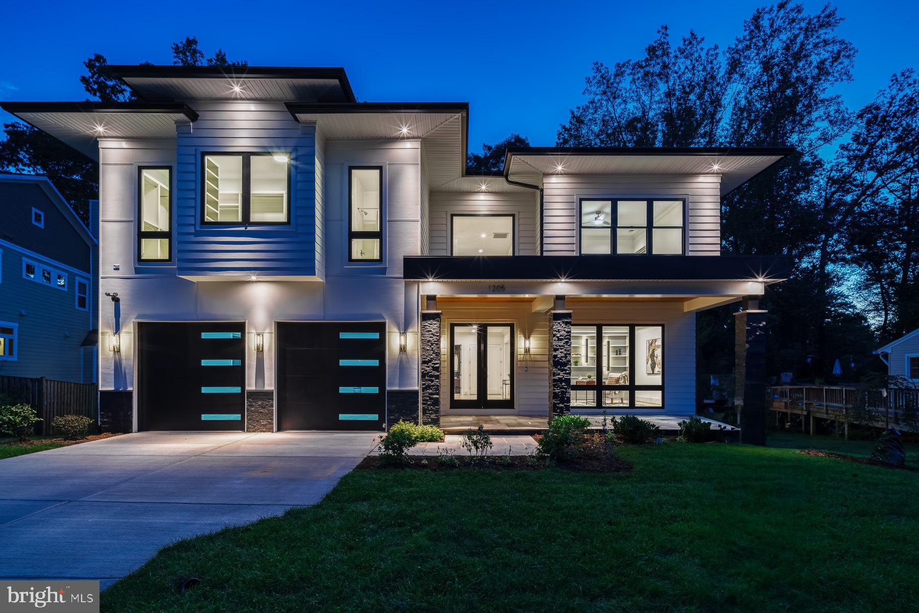 Warm yet Modern...this home is styled with great form and function and yet is appointed with exquisite finishing touches you will love.  With the natural beauty of wood features and the crisp sleek feel, this home in the sought after town of Vienna does not disappoint.  Built by A.R. Design Group, 1205 Ross Drive boasts 6 bedrooms, 5 full bathrooms, 3 powder rooms and nearly 8,000 square feet.  This home is spacious and sundrenched with a flowing floor plan.  

Sleek and Stylish describe this living room best.  This is the room where you will make memories to be cherished for years to come.  The floor to ceiling fireplace feature wall will provide a beautiful centerpiece to gather around in the cooler months.   The living room is well appointed with a coffered ceiling, recessed lighting, and the large paneless windows allow you to see the incredible wooded lot that provides so much privacy. Flanking this space is a substantial deck to entertain guests or enjoy your morning coffee.  

Dual-Tone upper and lower cabinets set this beautiful kitchen off to a great start. On trend, the natural tones of the wood in the lower cabinets warm everything up.  There is nothing sterile about this kitchen.  Dovetailed, 42” cabinetry, pot filler faucet, vegetable sink, 6 burner gas Jenn-Aire® range and spacious island large enough for four seats are just a few of this kitchen’s highlights.  Tons of storage and a wonderful flow finish out the space nicely.  

Dinner Parties will be made complete with the formal dining space.  This room transcends food. It represents a place where you unite with friends and family.  With views of the wooded lot and elegant lighting, this dining room will provide the perfect, inviting setting to entertain your friends and family with class and sophistication. Conveniently located off the kitchen, there is a butler’s pantry for cocktail preparation or a beautiful buffet set up for larger gatherings.

Light and Airy, are the key words for the primary suite.  Picture windows highlight the wooded lot.  Appointed with tray ceiling, recessed lighting, three custom complimenting walk-in closets and a primary bath fit for a 5-star hotel...there really is nothing else you could ask for.  

Fit for a spa...a showcase of elegance and peaceful ambience are found in this primary bathroom.  Equipped with a steam shower, multi-head and rainfall shower heads in your standing shower and a bench built for two complete this spacious room.  The centerpiece is a stand alone soaking tub looking out of the beautiful windows. If storage is on your mind, look no further.  Your dual-sink vanity comes with all the room you’ll need.  

Feeling like a main level, this lower level is a partially above ground, walkout with full size windows letting tons of light shine in.  Boasting 1 half bathroom, 2 bedrooms with an adjoining full bathroom, a fitness room, wet bar, elegant theatre room and topped off with a wine room...entertaining and hosting guests is a breeze.