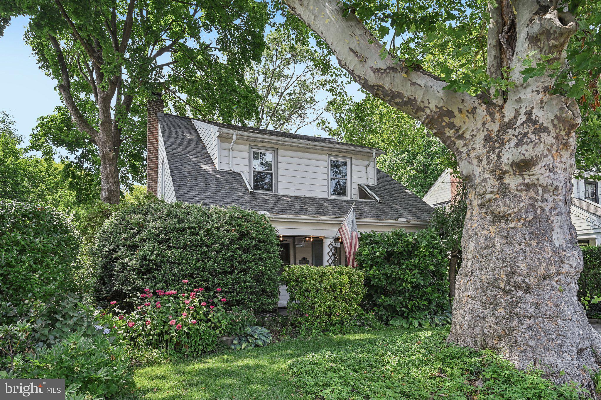 Welcome to this beautifully maintained 3-bedroom, 2.5-bath home that blends classic charm with thoughtful upgrades and inviting indoor-outdoor living. A stunning covered front porch offers privacy and the perfect place to relax, while inside, a large window seat with hidden storage overlooks the porch and fills the space with natural light. The spacious dining room features elegant French doors that open directly to the front porch, ideal for entertaining.

The heart of the home includes a warm family room with a wood-burning fireplace, built-in bookshelves, and cozy library-style accent lighting. Just beyond, a bright sunroom addition overlooks the serene, tree-filled backyard and garden, with access to the elevated Trex deck from both the sunroom and kitchen. The backyard retreat also includes a garage/workshop enclosure added beneath the deck, offering excellent storage or hobby space.

Downstairs, enjoy a cozy finished basement with engineered wood flooring, perfect for a media room, playroom, or home office. Upstairs, the primary suite is highlighted by a fully renovated en-suite bath and beautiful Bruce hardwood flooring. A partially renovated second full bath adds even more comfort and style.

Notable updates include a new roof and gutters, upgraded Trex deck, central air, 200 AMP electrical service, drywalled ceilings throughout most of the home, plantation shutters on select windows, and a kitchen accented with subway tile and brick backsplash.

Conveniently located near several local parks, including Ogontz Park and Tookany Creek Park, with easy access to public transportation such as SEPTA and regional rail. This home offers comfort, character, and thoughtful upgrades in a setting that’s easy to love. Mortgage savings may be available for buyers of this listing.