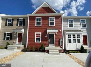 Discover your dream home in Jefferson County with this newly constructed 2023 Colonial Townhome, offering stunning views of the Blue Ridge Mountains. Located in historic Charles Town, WV, you'll be just minutes away from shopping, restaurants, schools, and the local casino. Embrace the vibrant Townes at Tate Manor community, with Jefferson Memorial Park and the charming town just a short walk away. Its prime location near the MD and VA lines makes it perfect for commuters, blending the tranquility of a scenic retreat with easy access to neighboring states. This home combines the ease of first-floor living with the expansive space of a three-story design. The first floor features a contemporary kitchen with stylish finishes, seamlessly connected to a generous living room—perfect for both relaxing and entertaining. Upstairs, retreat to the owner's suite, where you'll find a spacious walk-in closet and a luxurious, spa-like bathroom. Two additional bedrooms at the front of the home offer privacy and comfort for family or guests. With a driveway accommodating up to four cars, parking is always hassle-free. An EV charger is already installed for your electric car! Don’t miss the chance to make this 2023 Colonial Townhome your personal haven in Jefferson County.