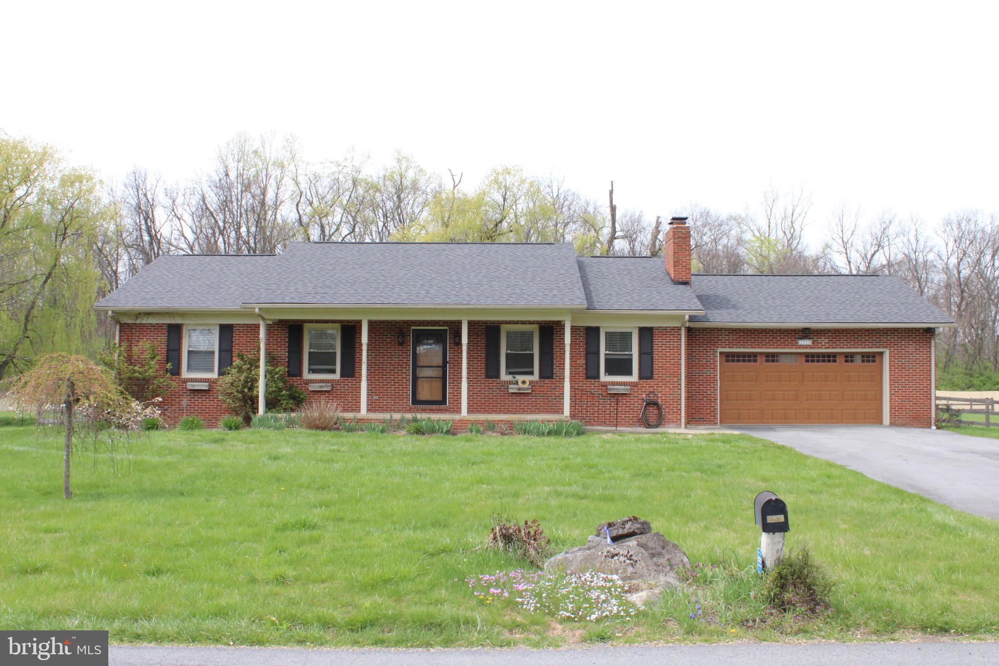 Well maintained Rancher on 2.38 acres just minutes from VA/WV line located on a lightly traveled section of Gold Miller rd.  House features a newly updated modernized kitchen, New roof in 2022, hardwood in the living room with wood burning fireplace.   Master bath has been updated as well.  Floor plan consists of 3 bedrooms and 2 full baths , central air/heat with Laundry on the main floor situated on an unfinished basement that could be finished for more living space.   Basement has a walkout to the side yard as well as a connecting stair off the Kitchen.   Oversized garage is 23' by 22' and back deck is approx 40' by 16' that leads to the backyard.   Back yard is fully fenced and has a nice flowing wet weather stream and a run in shed.  Plus, there is a separate fenced section set up for gardening.  Though minutes from shopping and interstate access its truly in a country setting so don't miss the opportunity to make this home your own!