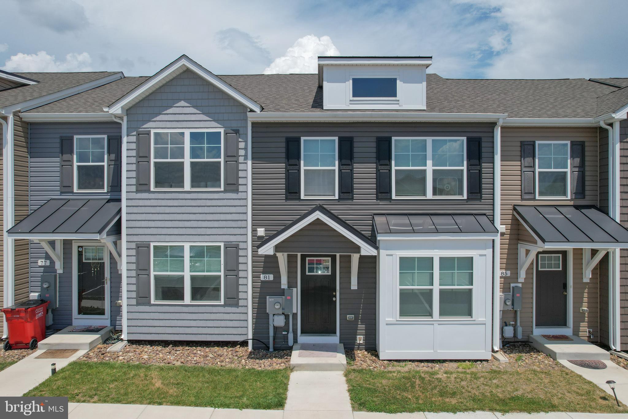 Welcome home to this beautifully designed 3-bedroom, 2.5-bath 2-story townhome offering modern finishes and spacious living throughout. The main level features luxury vinyl plank flooring, generous room sizes, and a bright, open layout with a bumped-out family room for additional living space. The kitchen is equipped with a center island, granite countertops, pantry, and plenty of cabinet space, making it perfect for both everyday living and entertaining.  Upstairs, the spacious primary suite includes a walk-in closet and private bath with double vanity and a tiled shower featuring a glass door. Two additional bedrooms and a full bath provide comfortable accommodations for family or guests.  Additional highlights include natural gas heating, attractive brick accents on the front exterior, and a 10x12 rear deck ideal for relaxing or outdoor gatherings. Conveniently designed with both style and functionality in mind, this townhome is ready to welcome you home. Moving to WV? Look no further than this affordable townhouse tucked away in Martinsburg, WV! Book your showing today!