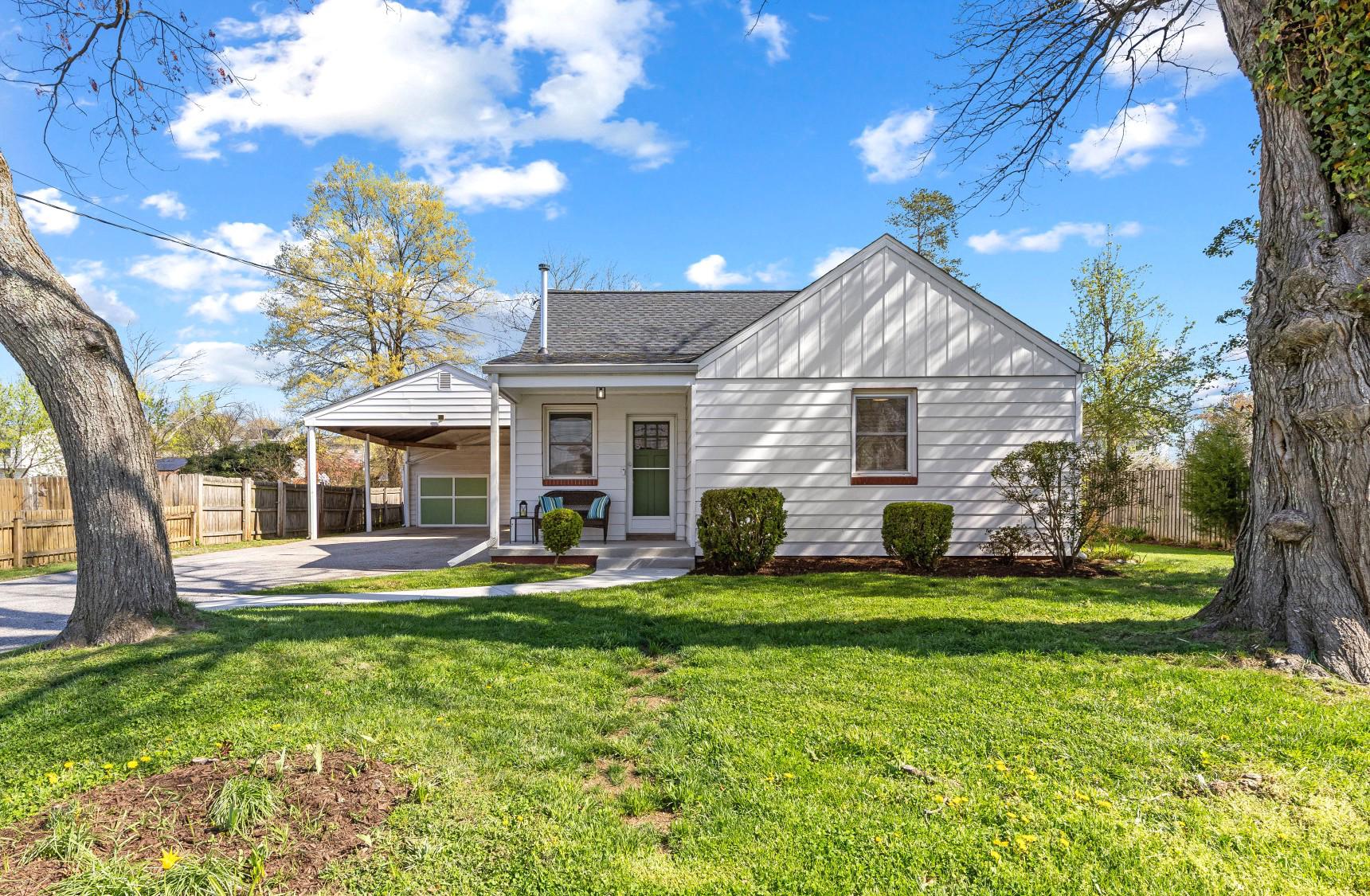 Charm and Curb appeal abound with this great 3 Bedroom, 1 Bath Cape in Severn's Cedarhurst Community.  Enter from the welcoming Front Porch and notice the gorgeous Hardwood Floors, Stained Trim/Woodwork and Doors as well as Fresh Paint and new Carpet in the Primary Bedroom.  The Built-ins and Pocket Doors add to the Period Charm as well as a Large Eat-in Kitchen with plenty of Cabinetry and Counter Space.  Other updates include Newer Replacement Windows and the Roof was replaced in May of 2025.  For the Car Buff or Project Enthusiast, there's an Oversized Detached Garage with workshop and a 60-amp subpanel for heavy equipment.  In addition, for added Parking/Storage there's an oversized 26 x29 Carport with 11-foot clearance.   The Attic with its walk-up staircase and flooring and Windows provides possible opportunity for future expansion.  Great Commuter Location - Just minutes from Highways, BWI, NSA and Fort Meade.   One Year Home Warranty Provided.