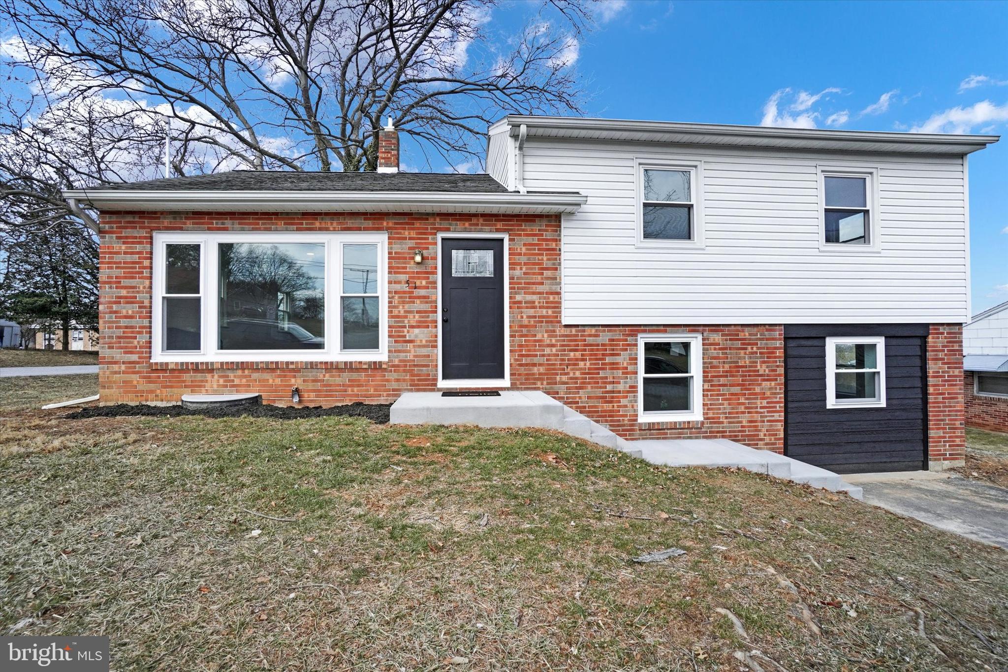 Beautifully renovated 4 bedroom, 2 full bathroom home.  The main level has upgraded luxury vinyl plank flooring in the living room, dining room and kitchen.  Quartz countertops, breakfast bar and soft close cabinets accentuate the kitchen.  Upstairs are 3 nice size bedrooms and a full bathroom.  The lower level has a 2nd living area that can serve as a fourth bedroom, play room, or family room, a full bathroom and a private room that can function as an office or walk-in closet.  There are so many possibilities with this home!  There are all new windows throughout, all new mechanicals and a brand new water proofing system.