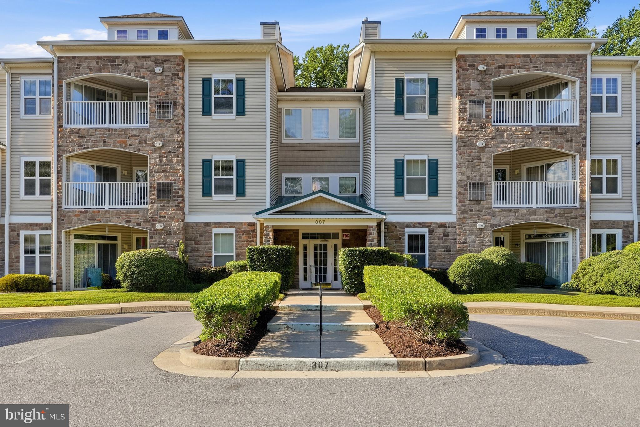 This spacious one level condo in a 55+ community is move in ready and available for you to see today. Enjoy the open floor plan where everything flows seamlessly. Bedrooms are on opposite sides to allow for privacy when you have guests or family stay the night. Soak in the tub, or simply enjoy the spacious bathroom. Closet is a walk in and allows you to have an endless wardrobe. Unit is easily accessible by means of an elevator. Beautiful wood floors in the living room. Enjoy this space and get cozy by the fireplace. On a nice day, enjoy some time out on the balcony. Washer and dryer in unit. Easy and fun living with everything you need in the building. Head downstairs and be a part of the community in the common areas. There is even a common area kitchen if you'd like to throw parties and have snacks and beverages to place somewhere. Make friends and head over to the ping pong or pool table for friendly competitions. Stay active and head over to the fitness studio. All of these things are in the same building, just an elevator ride away! Feel safe with the sprinkler system inside the unit. When you want to come out of the building, enjoy the walkways filled with trees, greenery, and fresh air. Benches are conveniently located along the walkways. Head over to the gazebo style area and have lunch outside or head over to the community greenhouse and start your next project. Whatever it may be that your heart desires, you will find it here, at 307 Wyndham. Come by, check it out, fall in love.