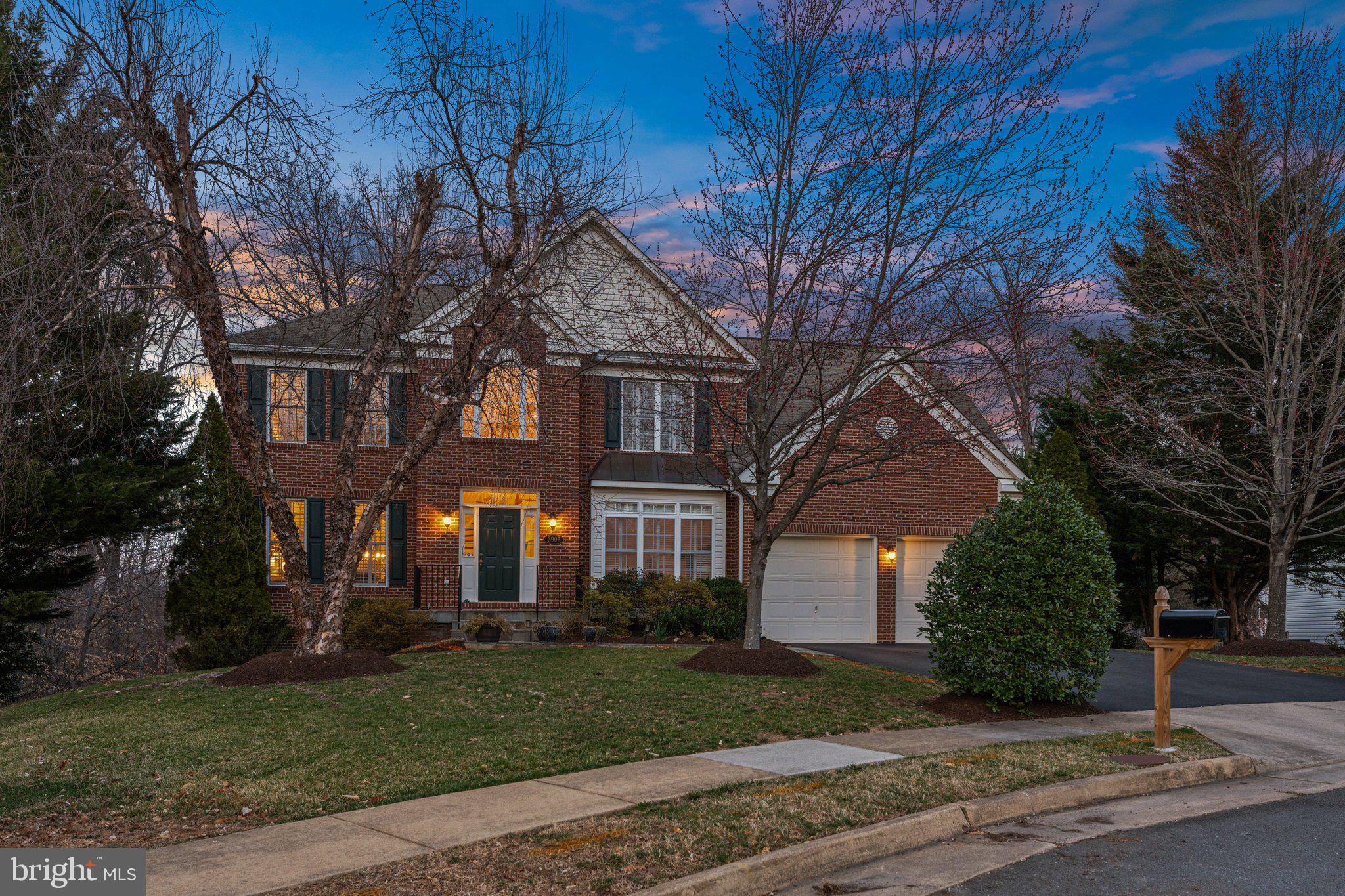 Tucked away on a quiet cul-de-sac in the charming Highland View subdivision, 3903 Cook St. is a stunning brick-front colonial offering both elegance and comfort. Sitting on a beautifully landscaped .37-acre lot adjacent to peaceful woods, this home has a two-car garage and inviting curb appeal.

Step through the front door into a grand two-story foyer, where oak hardwood floors span the entire main level. The spacious eat-in kitchen features classic oak cabinetry, Corian countertops, a center island with an electric cooktop, and a bright breakfast area framed by bay windows overlooking the expansive backyard. The kitchen seamlessly flows into the breathtaking two-story family room, complete with a cozy gas fireplace and doors leading to a huge screened-in porch—the perfect spot to enjoy your morning coffee while soaking in the sights and sounds of nature.

The main level also offers a formal dining room that opens to a sun-drenched living room, ideal for entertaining. A private home office/study provides a quiet space for remote work.
Two staircases lead to the bedroom level, where you'll find four spacious bedrooms and three full bathrooms. The luxurious owner’s suite features hardwood floors, an oversized walk-in closet, and a spa-like private bath with a jetted soaking tub, separate shower, and dual-sink vanity.

The fully finished lower level is designed for both relaxation and fun, offering brand-new carpet, a sprawling recreation area—perfect for a home theater or game room—a non-conforming bedroom, a full bath, and a huge storage room. Walk-out doors lead to a brick patio and beautifully landscaped backyard with a walking path.

Enjoy this tranquil retreat with the added convenience of easy access to everything inside the Beltway.