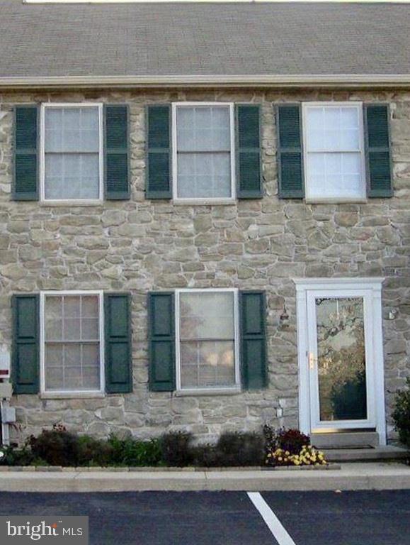 Stone front townhome in conveniently located Farmbrooke. Mow/snow provided in assoc fee. New heat pump is efficient and comfortable year round. The daylight walk out basement has an Owner Corning wall system in place...needs flooring.  Family room and office/playroom on that level.  Seller offering a $5,000 credit at settlement for cosmetic upgrades needed...livingroom carpet, paint etc. or can have those items done right before settlement...