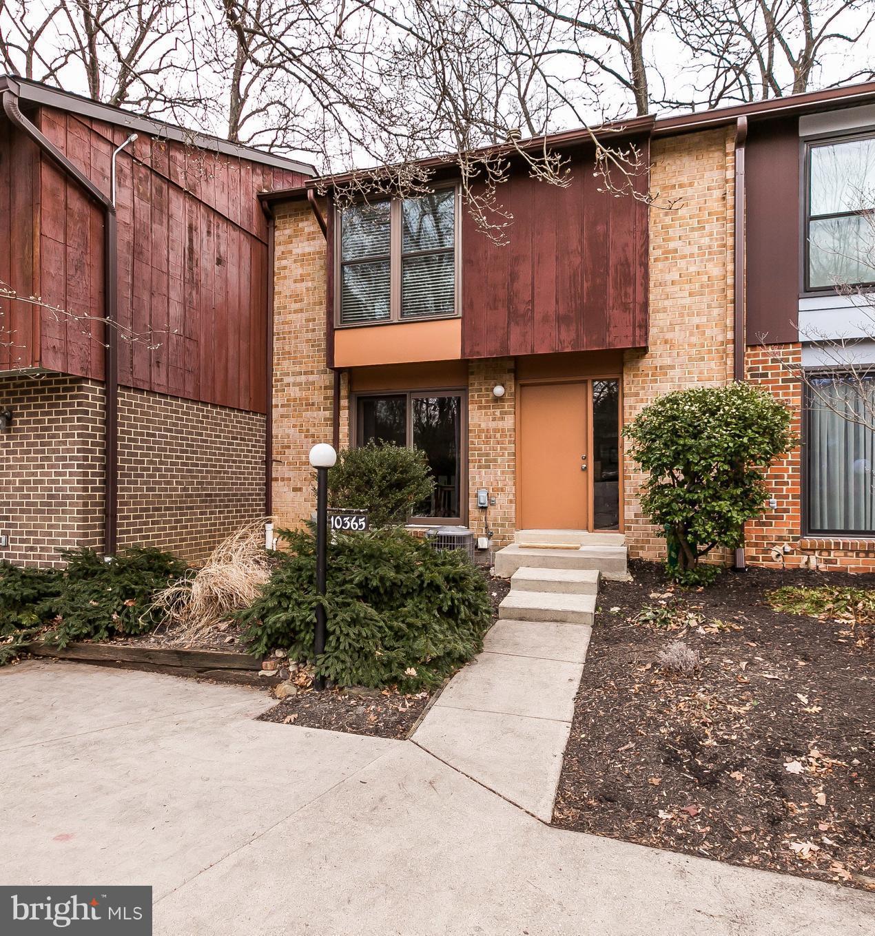 Beautiful townhome nestled in wooded surroundings. 3 large bdrms & 3 full baths. Brand new roof, updated windows, new sliding doors on main level. Newer washer/dryer, HVAC, water heater, 3 rack dishwasher & induction range w/ convection oven. Deck off living room overlooking nature. Fully finished basement opening to large private patio.  Stroll to Lakefront restaurants, Wholefoods, mall shopping.