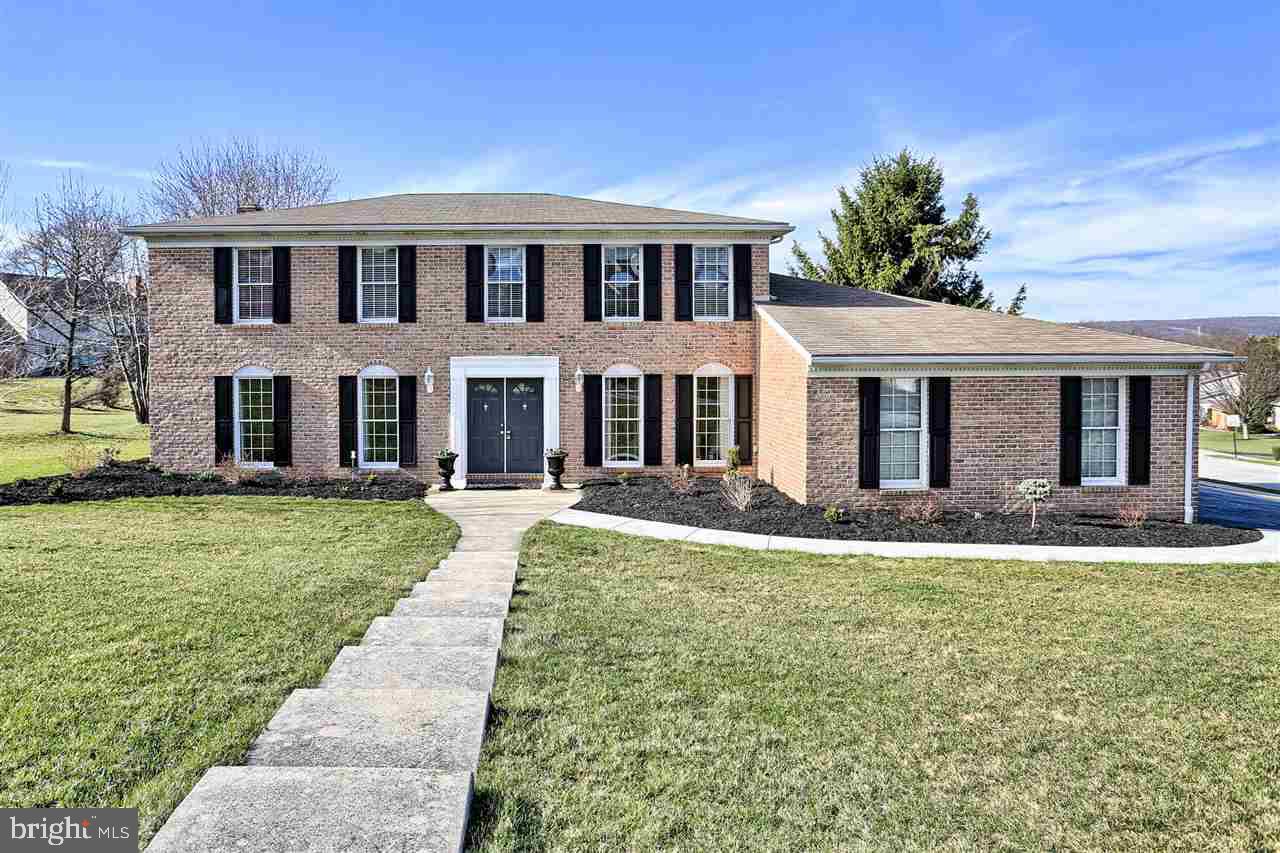 Classic all brick Colonial on double sized corner lot in Penn Oaks. Delightful  Curb appeal, spacious floor plan, large finished basement w/wet bar + 3 car garage are just a few of the highlights! Solidly built w/walk-in closets in 3 of 4 bedrooms, 2 full & 2 half baths, new HDWD flring on 1st floor, family rm w/gas fireplace that's open to kitchen w/large bay window & SS appli's, 3 season room w/access to paver patio & nicely landscaped yard.