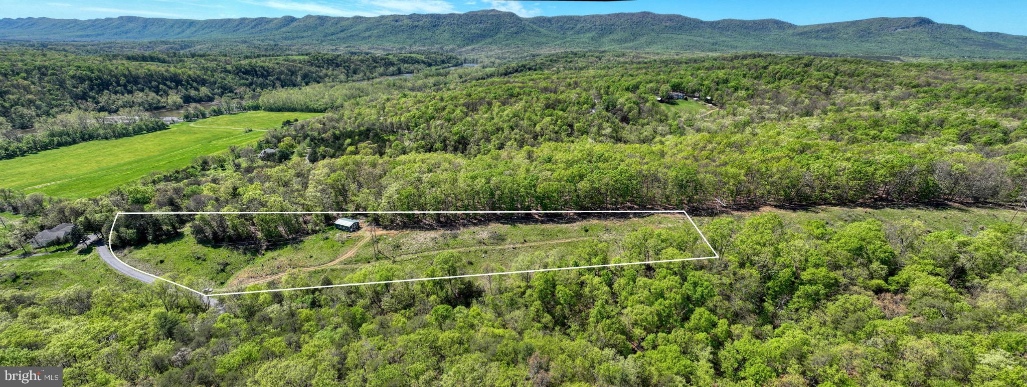 Welcome to Thunderbird Farm—an outdoor enthusiast’s dream set on 5.45 scenic acres in the heart of the Shenandoah Valley. Tucked just minutes from the expansive George Washington National Forest, this property offers the perfect blend of serenity and adventure.

Spend your days hiking wooded trails, kayaking and fishing nearby waterways, or simply soaking in the sweeping mountain and river views from your own slice of paradise. With community river access just a short walk away, the outdoors truly becomes an extension of your backyard. Whether you envision building a peaceful weekend retreat or your forever home, the natural beauty and privacy here create an exceptional opportunity.

Just down the road, a local campground enhances the lifestyle with a seasonal pool, charming café, and even a petting zoo—perfect for weekend fun or hosting visiting family and friends. 

Located a short drive from the vibrant town of Front Royal, you’ll enjoy convenient access to Main Street’s popular restaurants, a local brewery, antique shops, and community festivals. Plus, nearby Skyline Drive offers unmatched valley views, abundant wildlife, and breathtaking fall foliage.

Don’t miss your chance to own a beautiful piece of mountain living—where adventure meets tranquility at Thunderbird Farm.