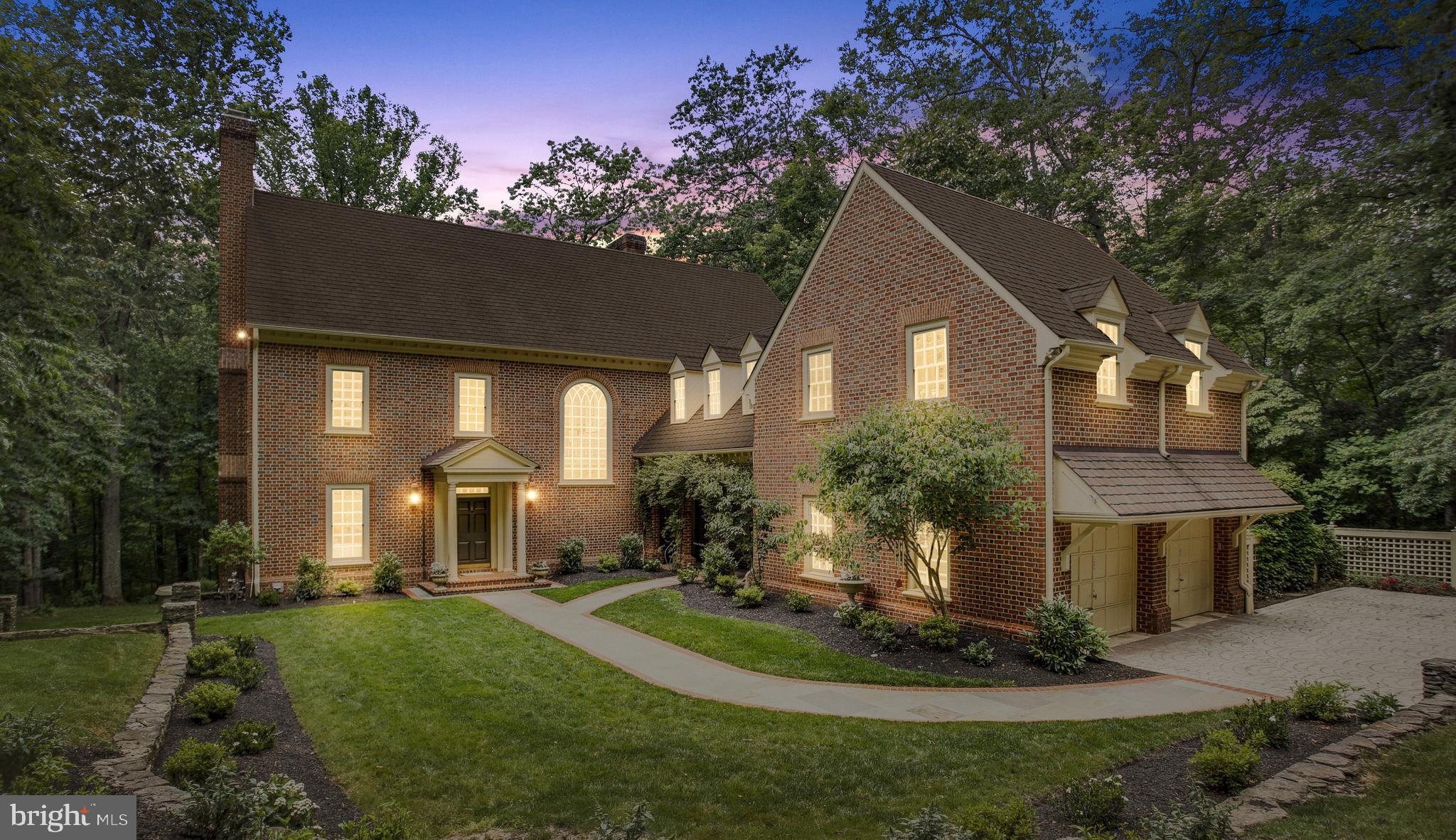 Welcome to the exquisite, custom charm of 930 Towlston Rd. This home's gorgeous hardwoods, detailed doorways, beautifully crafted windows, detailed crown molding, and new modern fixtures are sure to make a statement as soon as you walk inside the front door. Built by illustrious custom builder, Eugene Cullinane, details include crafted trim and beautiful woodwork. The main level features a gourmet chef's kitchen with gorgeous white cabinetry, an oversized dining room with a wood-burning fireplace, a study with built-in cabinetry, a formal living room with direct access to the balcony, and a den perfect for unwinding.  There is a gorgeous stone balcony made for grilling and enjoying the private yard and extended outdoors off of the den. Walking upstairs, there is a grand window that beams sunlight throughout both the main and upper levels. Each of the four bedrooms on the third level has an en-suite bathroom. The primary suite has a beautiful wood-burning fireplace, two walk-in closets, and the perfect spa bathroom with a soaking tub. Off the fourth bedroom is an unfinished bonus space over the garage that can be finished out to add a full office, larger bedroom, or another recreation room. As you make your way downstairs to the lower level, there is a guest bedroom with a full en-suite bath that gives your guests plenty of privacy. Along with the guest bedroom, the home office and gym are located downstairs. The gym can easily be used as a recreation room if preferred.  A covered stone patio on the lower level is perfect for a private retreat to the shade from that summer sun. The lavish-sized rooms provide this home a perfect setting for large-scale entertaining or a private oasis. And the bordering woods & nearby trail make living at 930 Towlston feels like a cozy getaway.