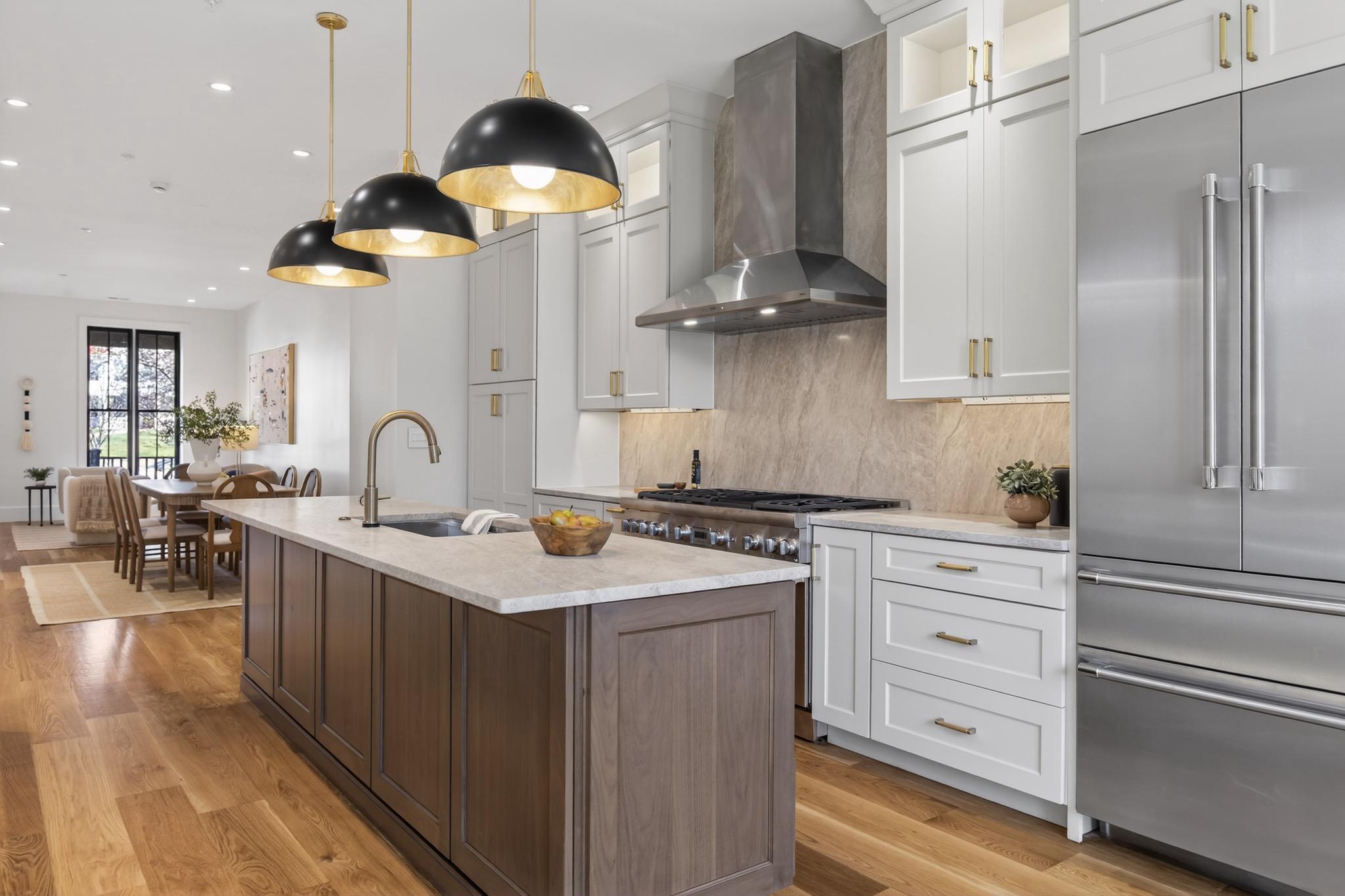 The facade of this completely renovated home gives no clue to the contemporary masterpiece behind it!  Meticulously designed and expanded to 4000+ square feet of luxurious modern living space on one of Capitol Hill's best blocks: prepare to be awestruck!  Wide plank oak floors grace the top 3 floors while the basement sports ceramic white oak plank flooring.  Entertaining as well as daily living will be sheer joy in the stunning chef's kitchen!  The entire top floor is dedicated to the luxurious primary suite, better described as "the sanctuary!"  The second level features 2 bedroom suites plus a den/study and laundry room.  And the lower level, easily accessible from the kitchen, provides a spacious media / play room with direct access to the beautifully landscaped rear patio, as well as a guest bedroom and full bathroom. Convenient rental parking available one block from property.  No detail overlooked.  No expense spared.  Nothing compares.  Ask about possible seller financing.